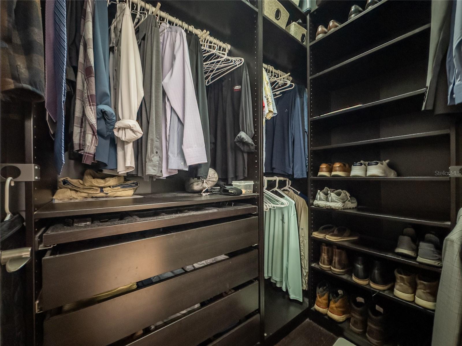primary closet with custom built-ins