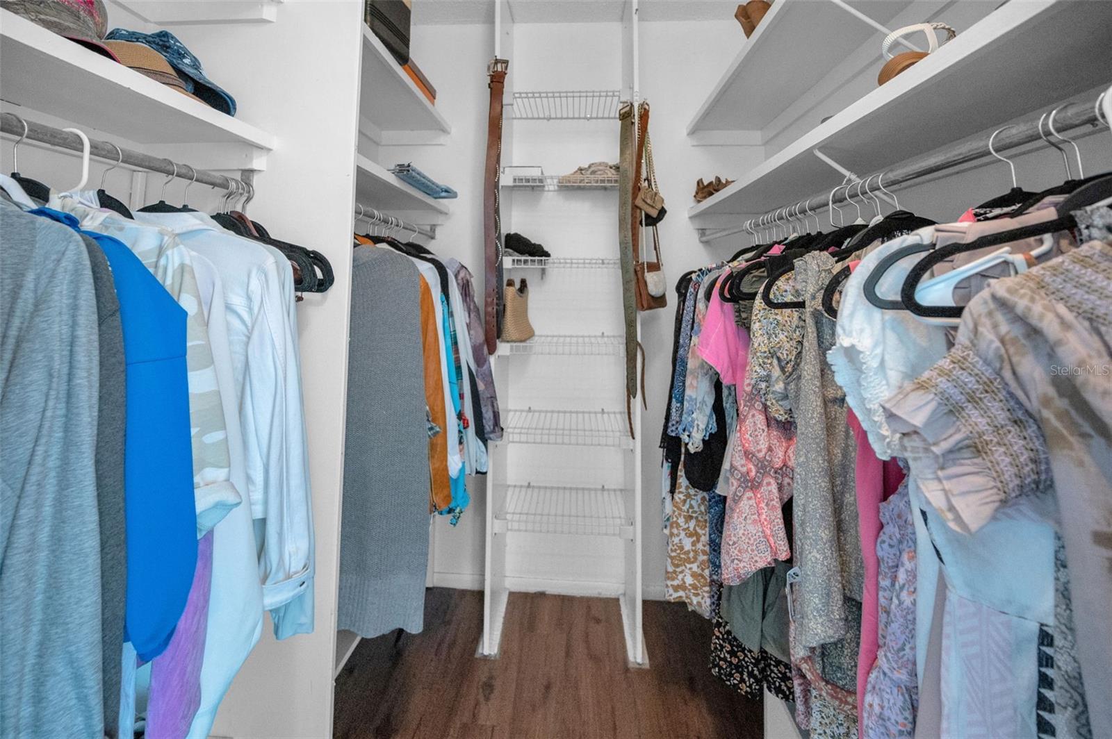 Primary bedroom walk in closet