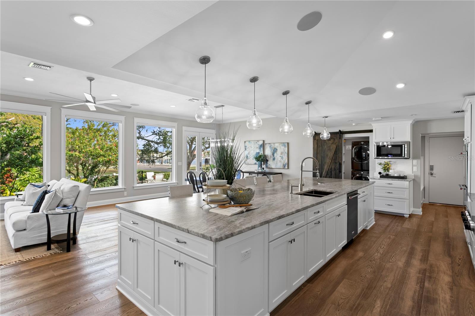 Single piece of leathered granite is the icing on the spacious, storage-rich island.  Cabinets on 360 degrees.