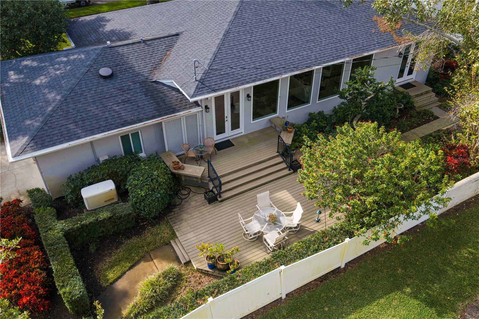 Dual-tiered entertaining deck with water and Snell Isle views