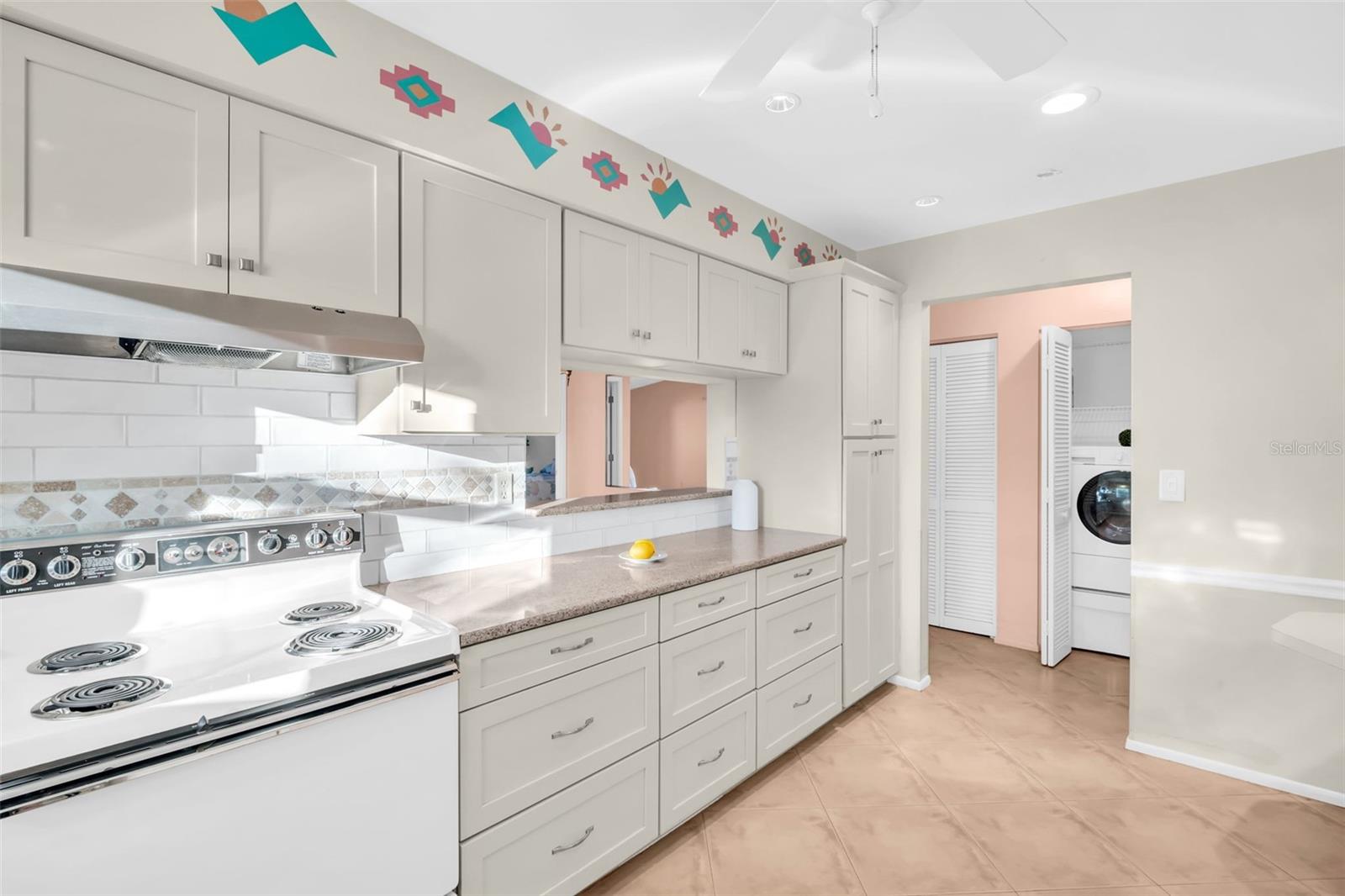 Updated solid-wood soft close cabinetry with built-in pantry~