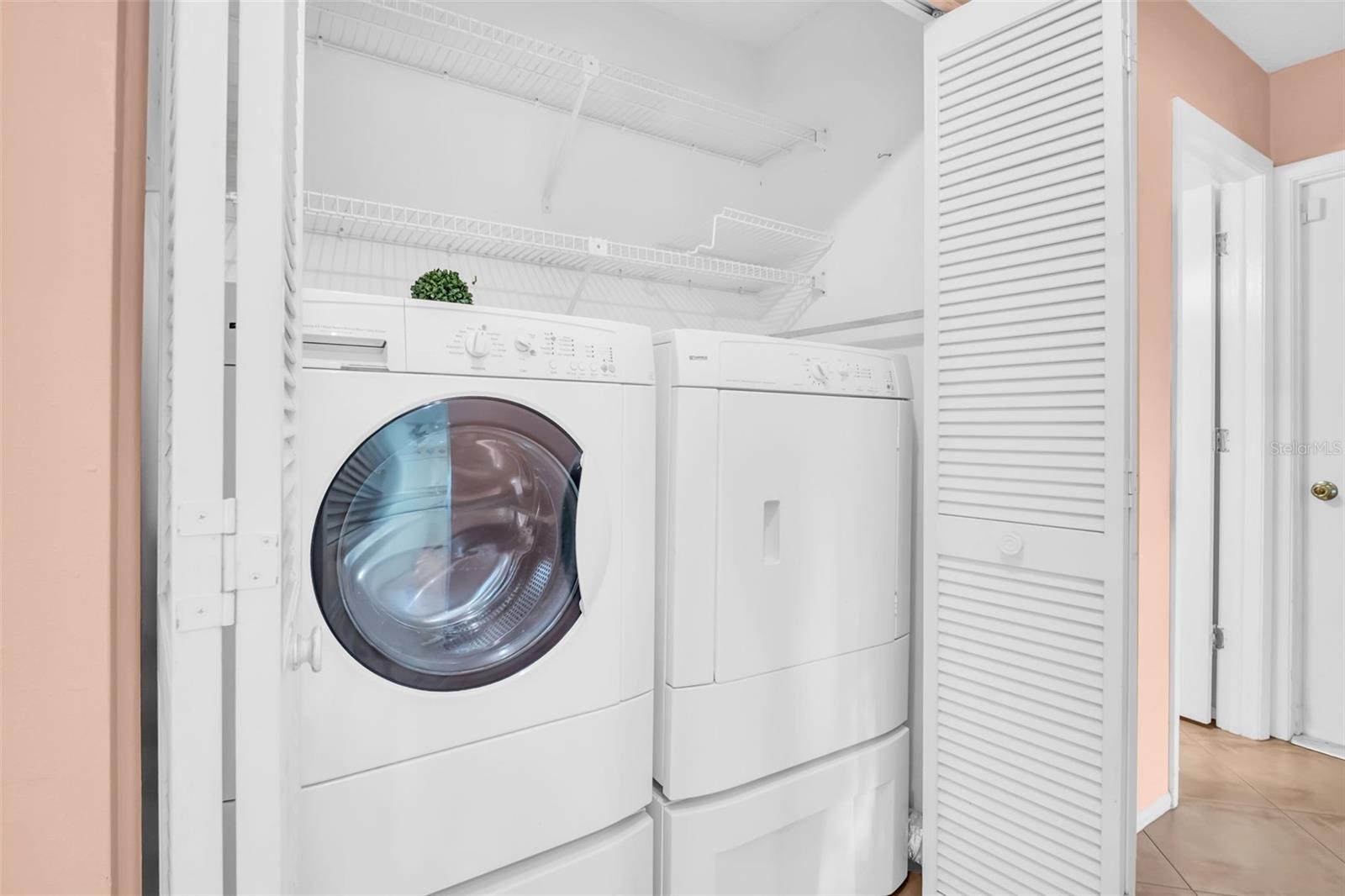 Indoor laundry room with newer washer/dryer~