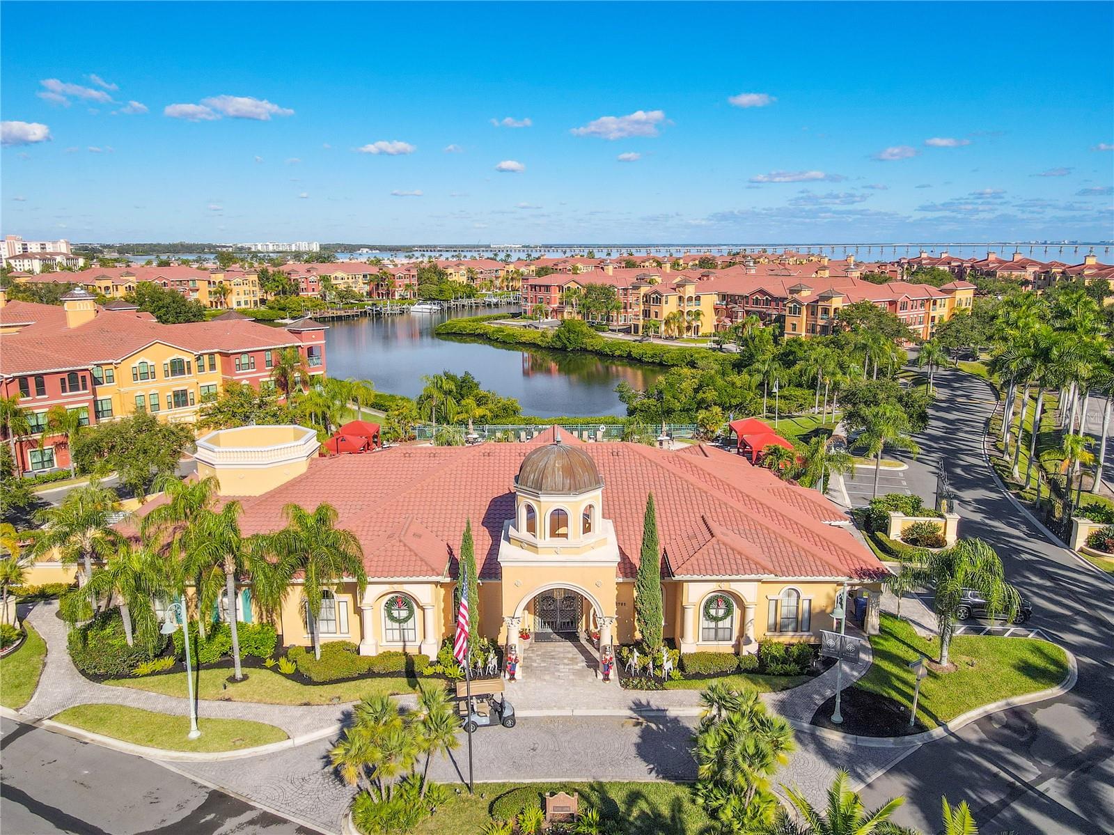 The grand clubhouse anchors the community with a stunning resort-style pool, twin sun-shelf basins, and palm-lined lounging areas designed for both relaxation and social gatherings.