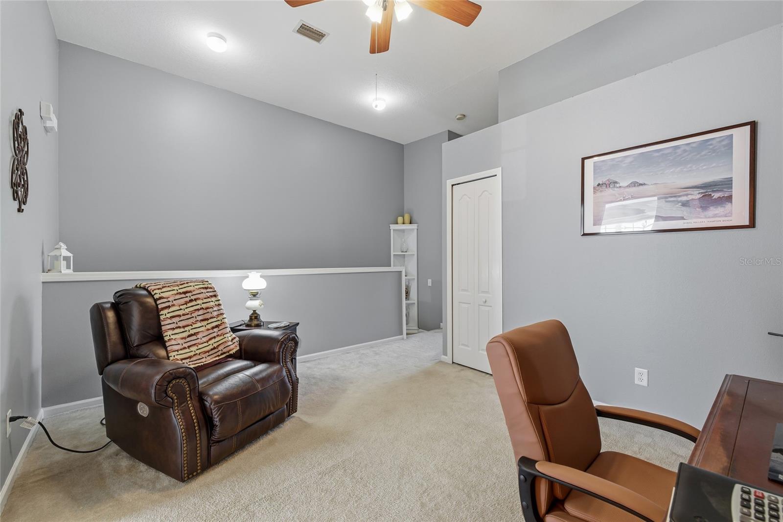 Loft area, behind the chair are the stairs going down to main floor