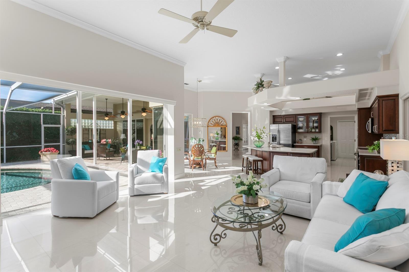 Tripple Sliding Glass Doors Out To Pool.