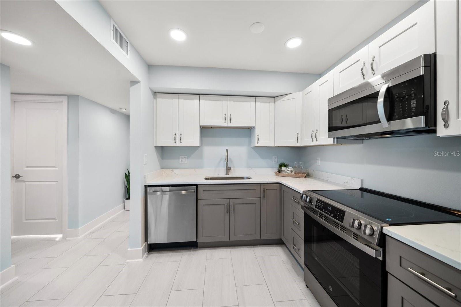 Contemporary finishes lend to the sleek lines of this very attractive property.