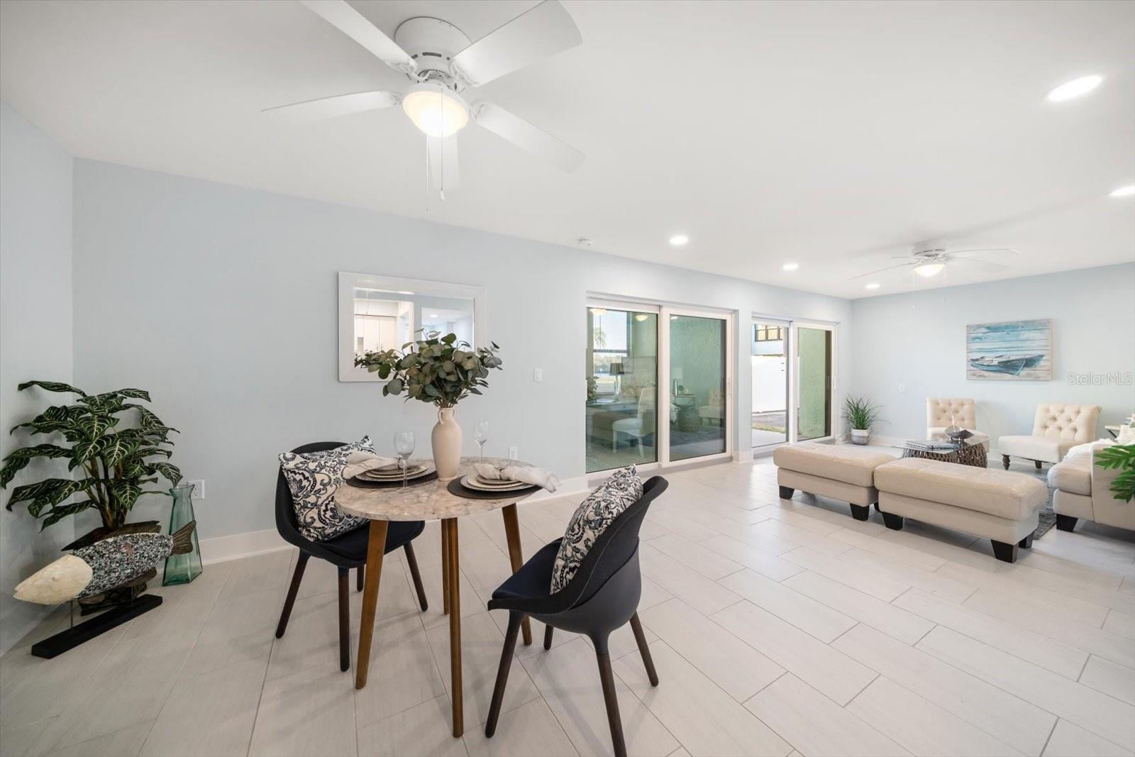 Great room and enclosed lanai overlook the grounds and intracoastal.