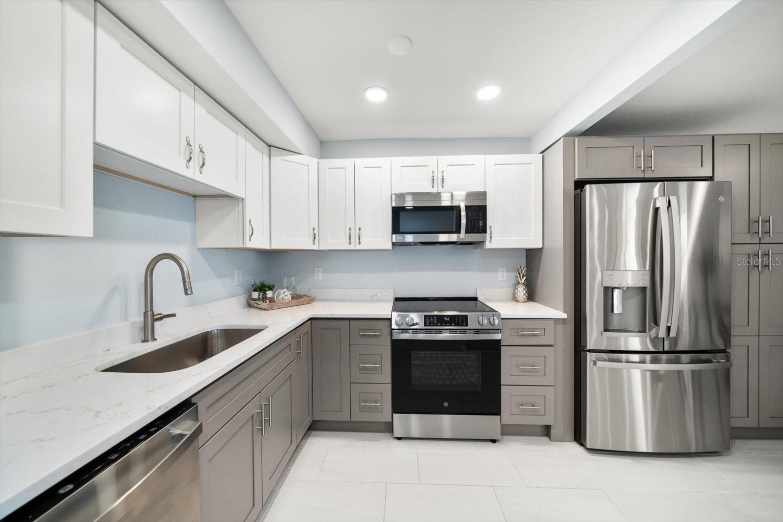 Clean lines, abundant cabinetry with storage and new appliances are just a few attributes of this lovely kitchen