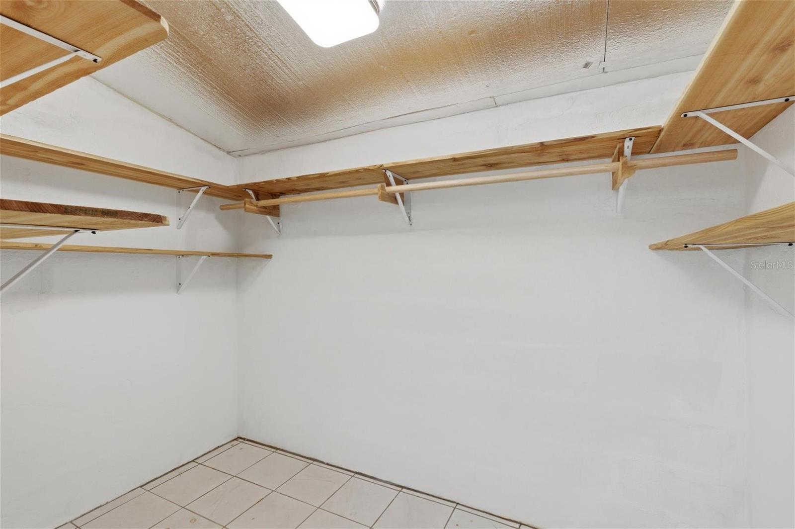 Walk-in closet in primary bedroom