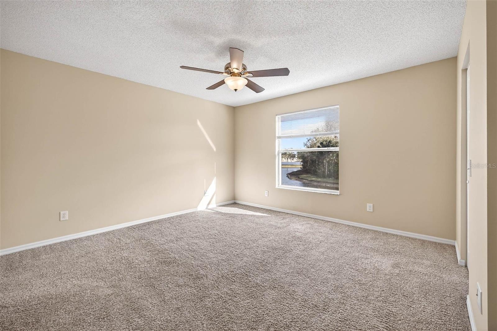 Primary bedroom pond view