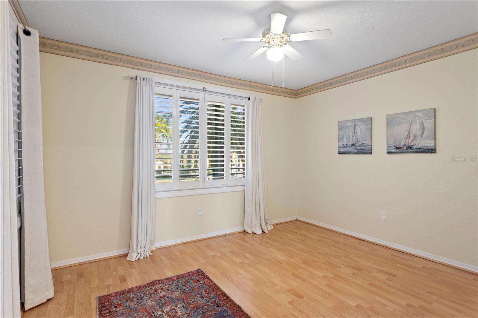 2nd Bedroom with Palm tree View and Plantation Shutters