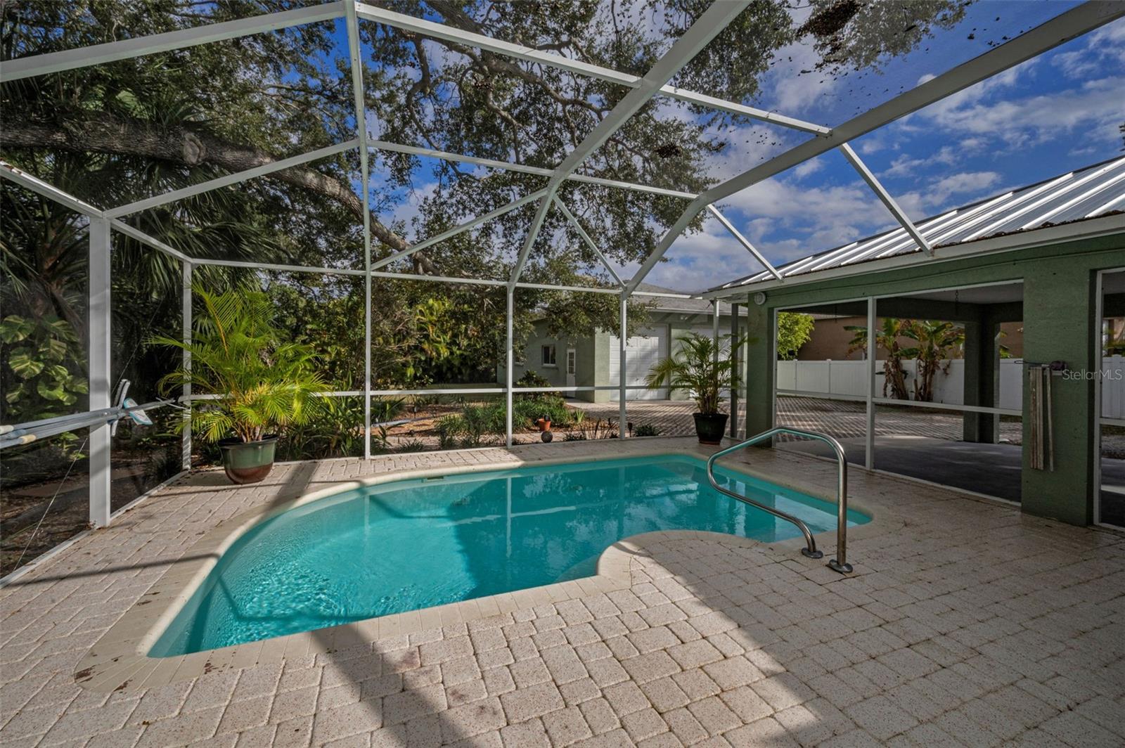 Entertain family and friends or relax in your gorgeous, screened lanai, complete with a sparkling pool.