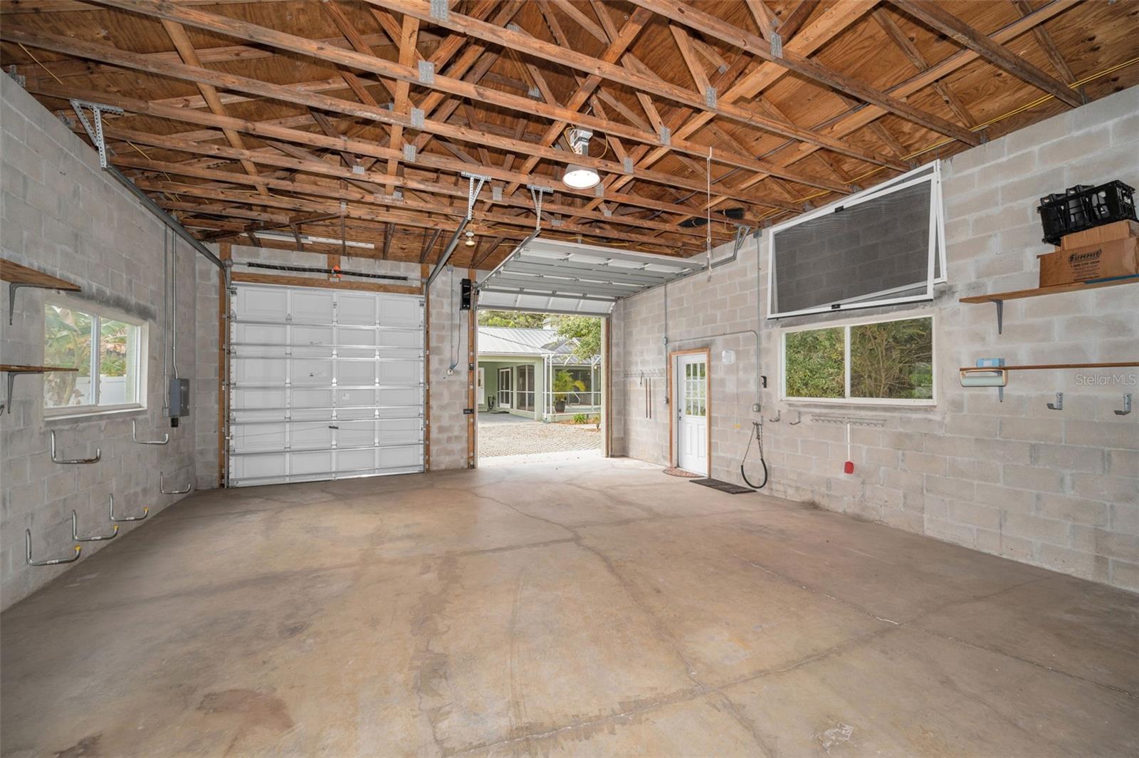 This garage has 3 doors allowing you to pull an RV, boat, truck etc straight through.  Also perfect for a car collector.