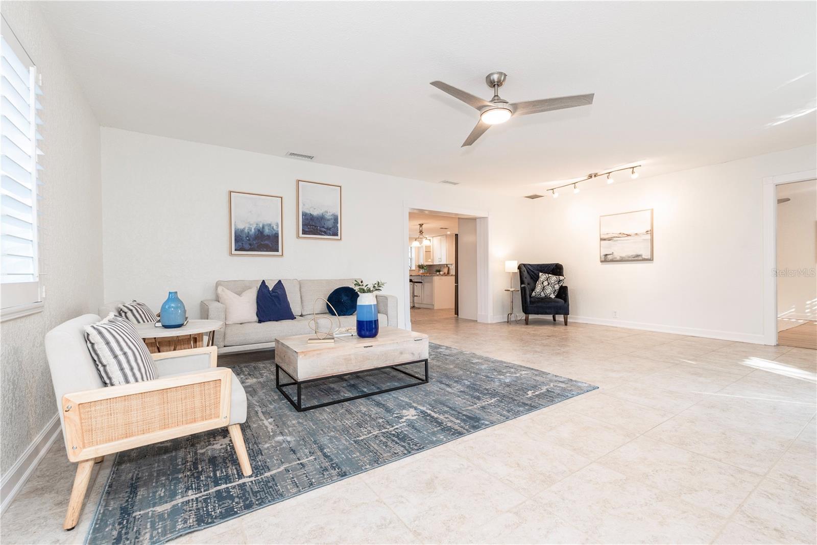 Living room with a special nook for artwork, dry bar, reading corner.