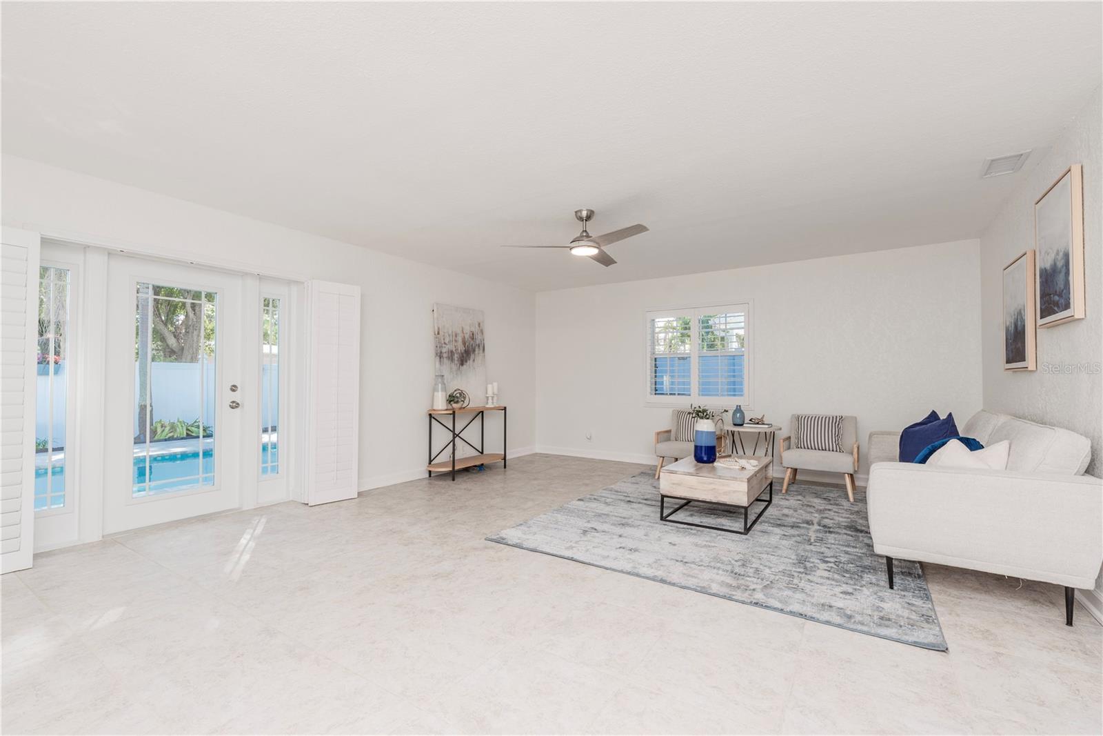 Door from living room leading to pool lanai.