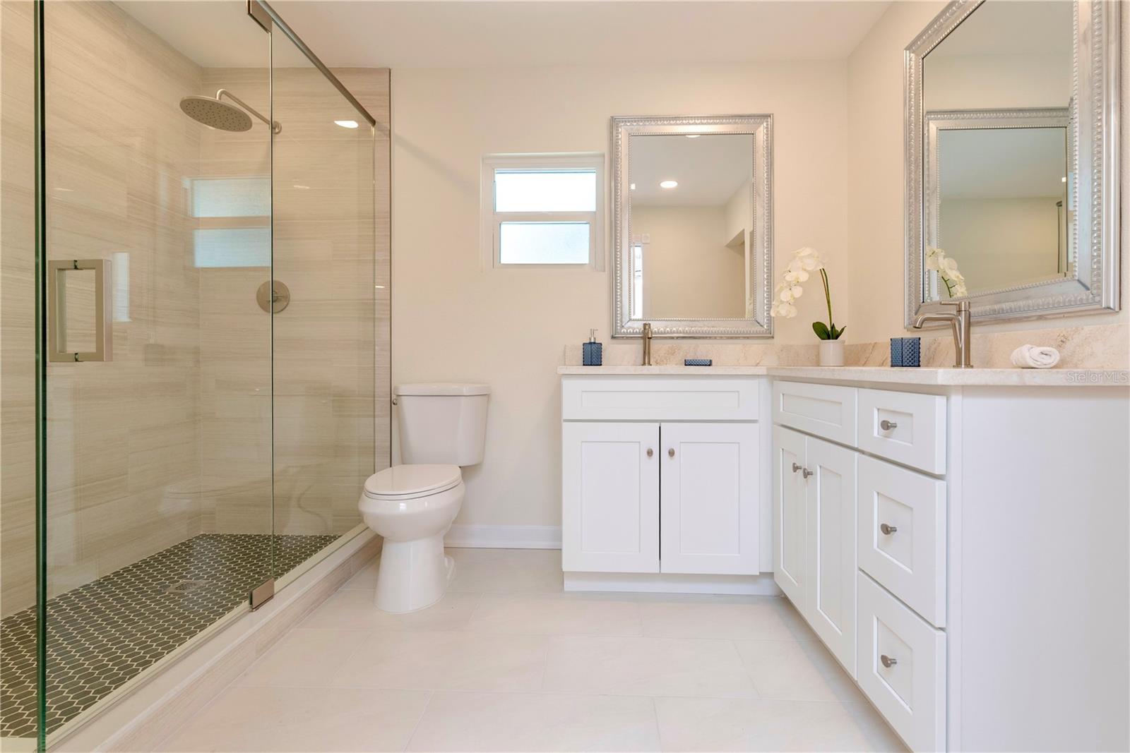 Primary bathroom with dual sinks.