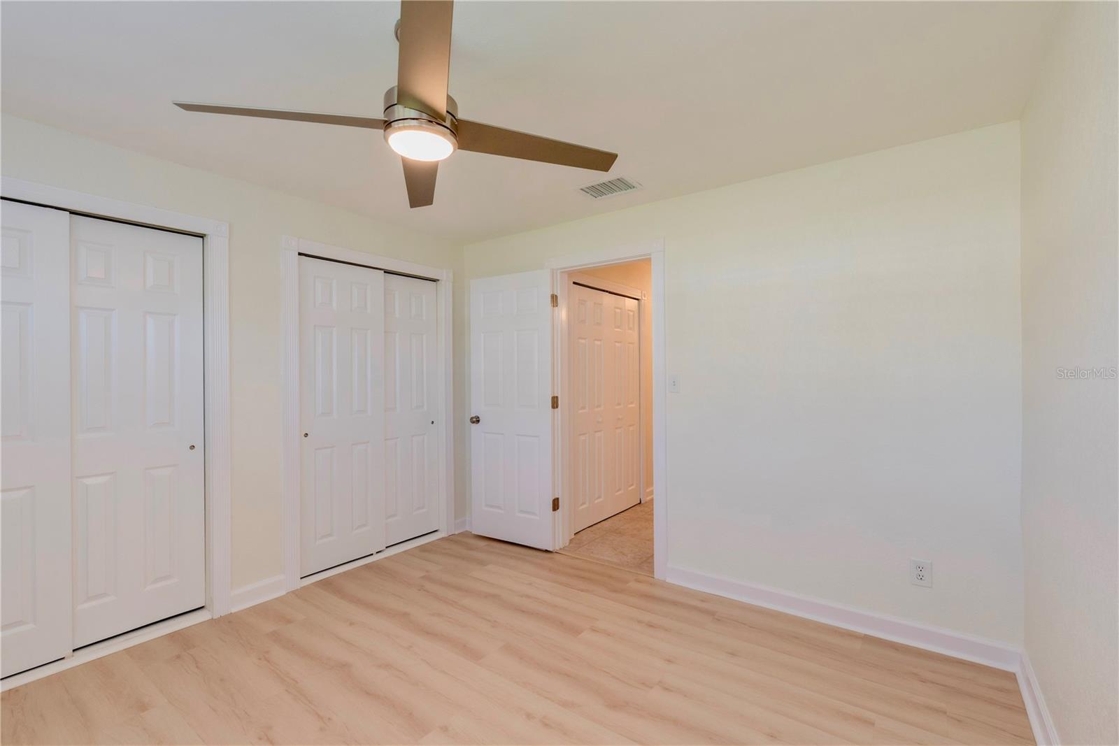 Bedroom 2 with dual closets.