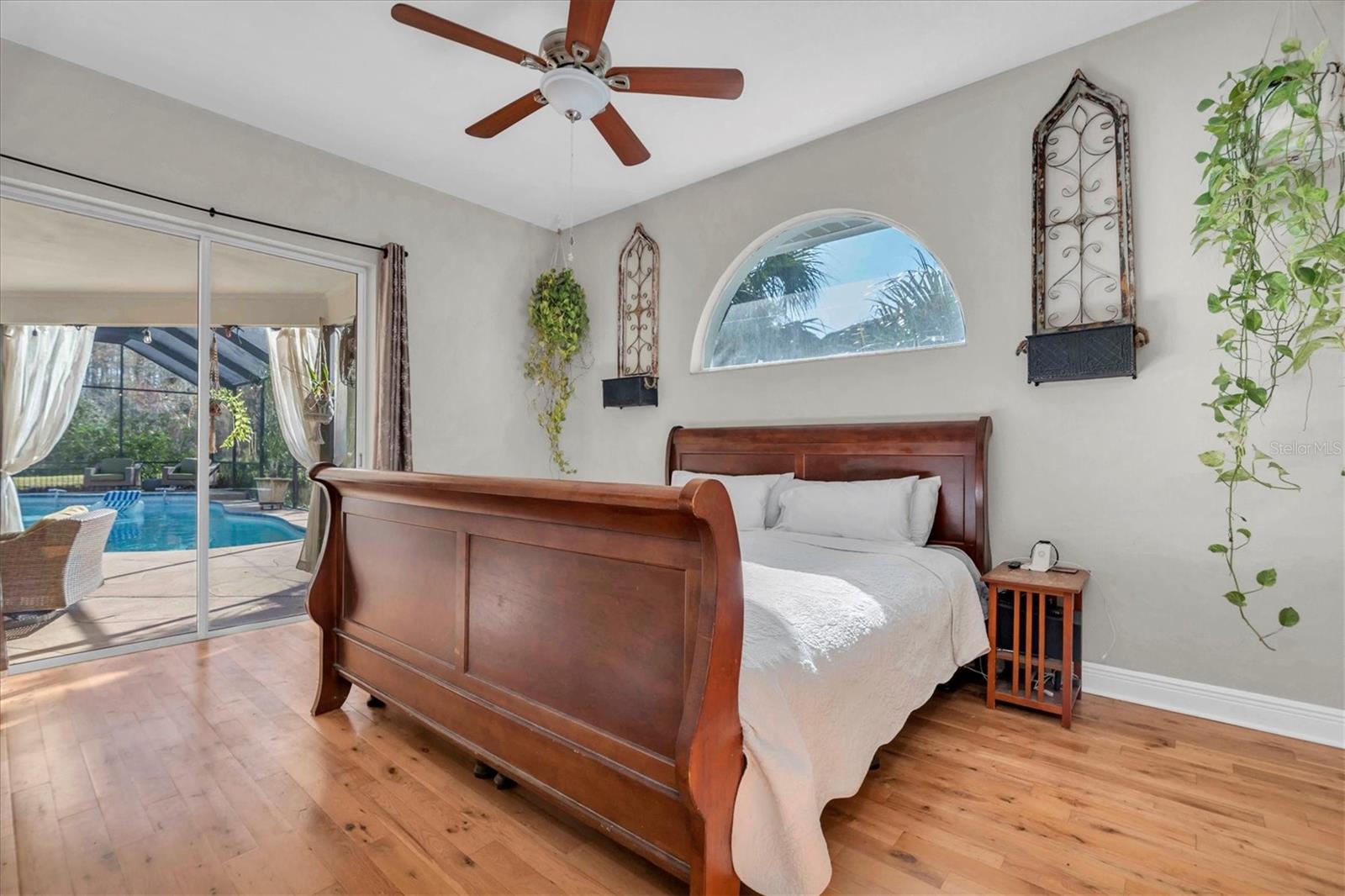 Primary bedroom overlooking pool/ large pond area)