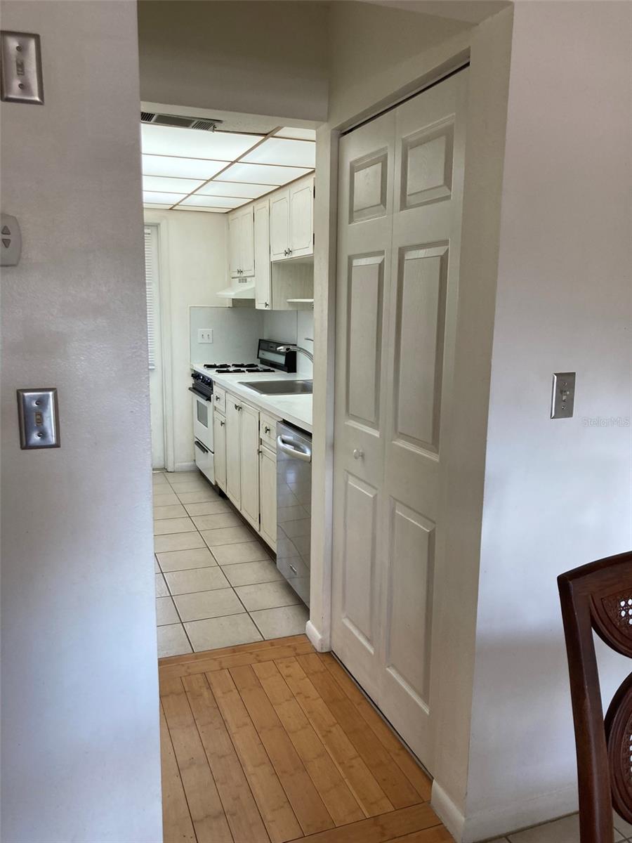 Looking from the dining room to the kitchen