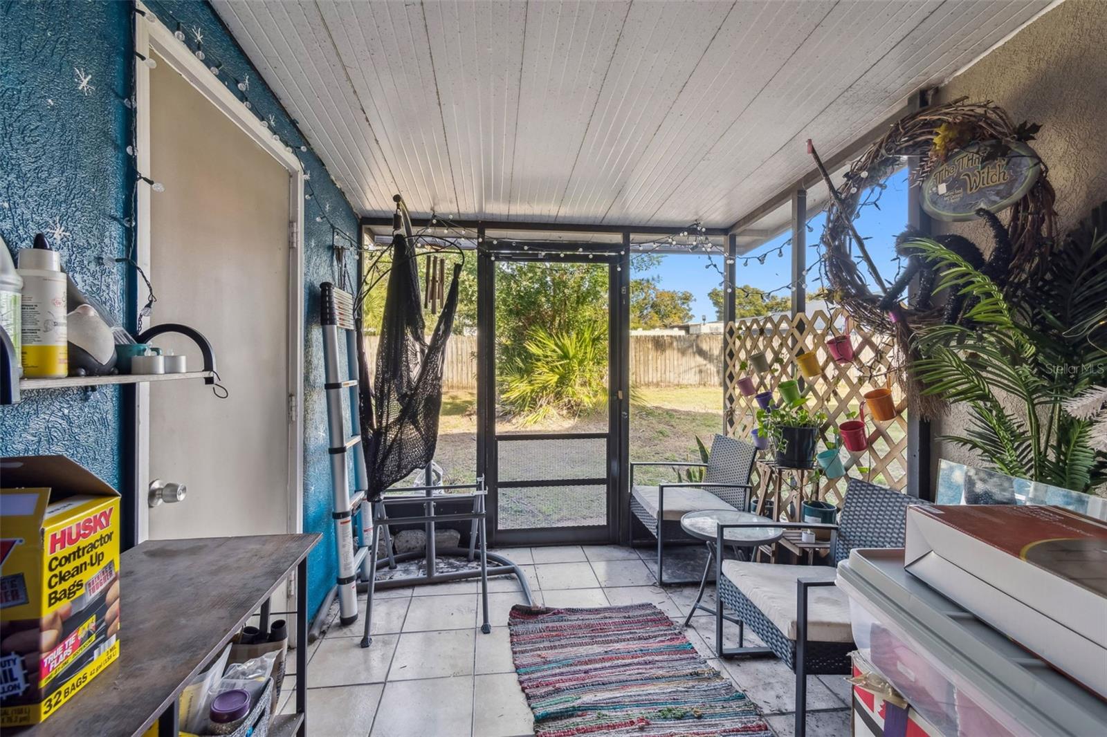 Screened in patio with laundry room to the left