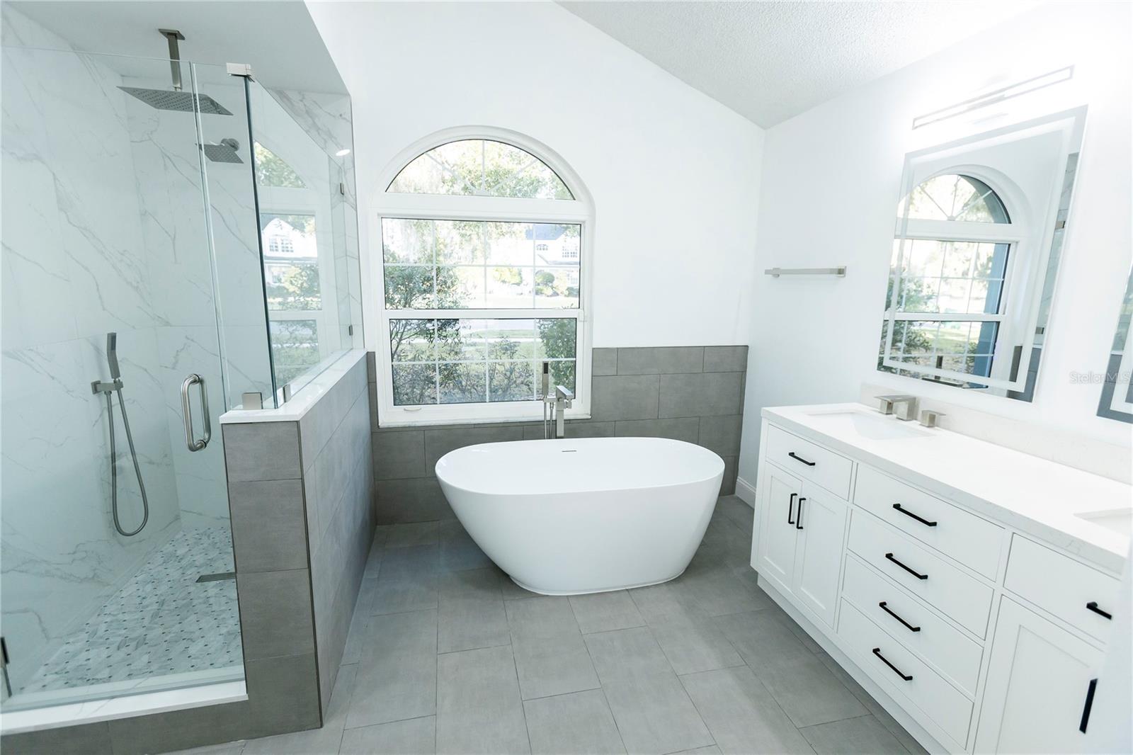 Primary Bathroom Soaking Tub View Front of Home