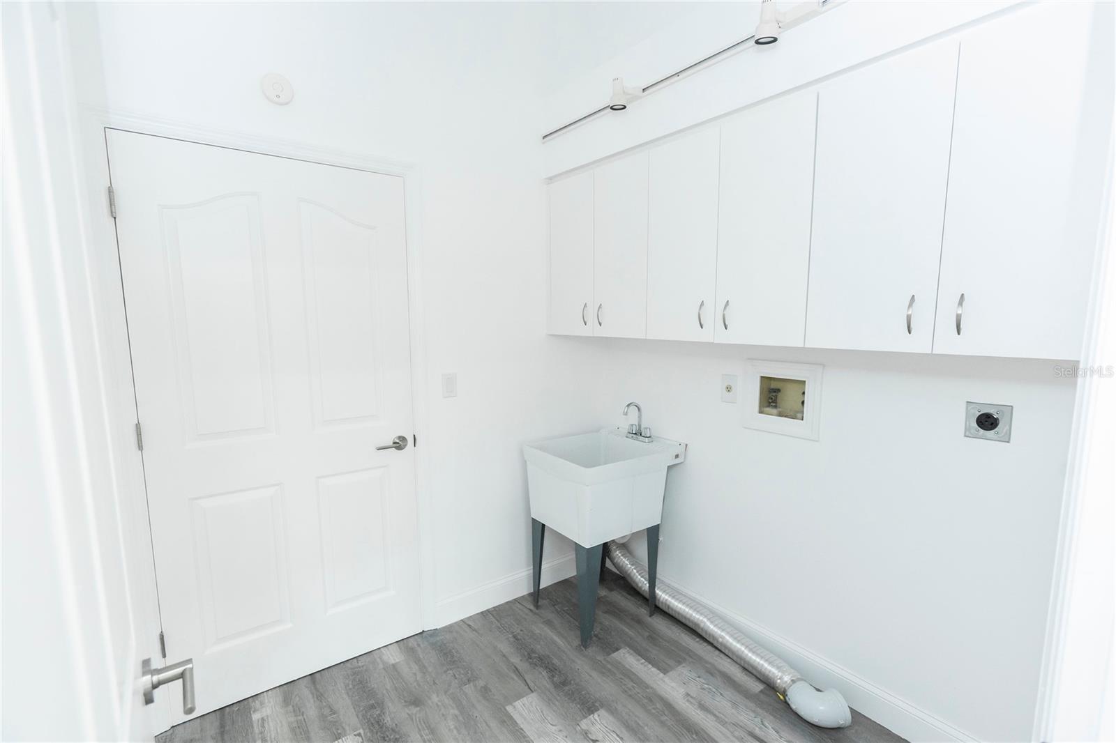 Inside laundry room that opens to garage