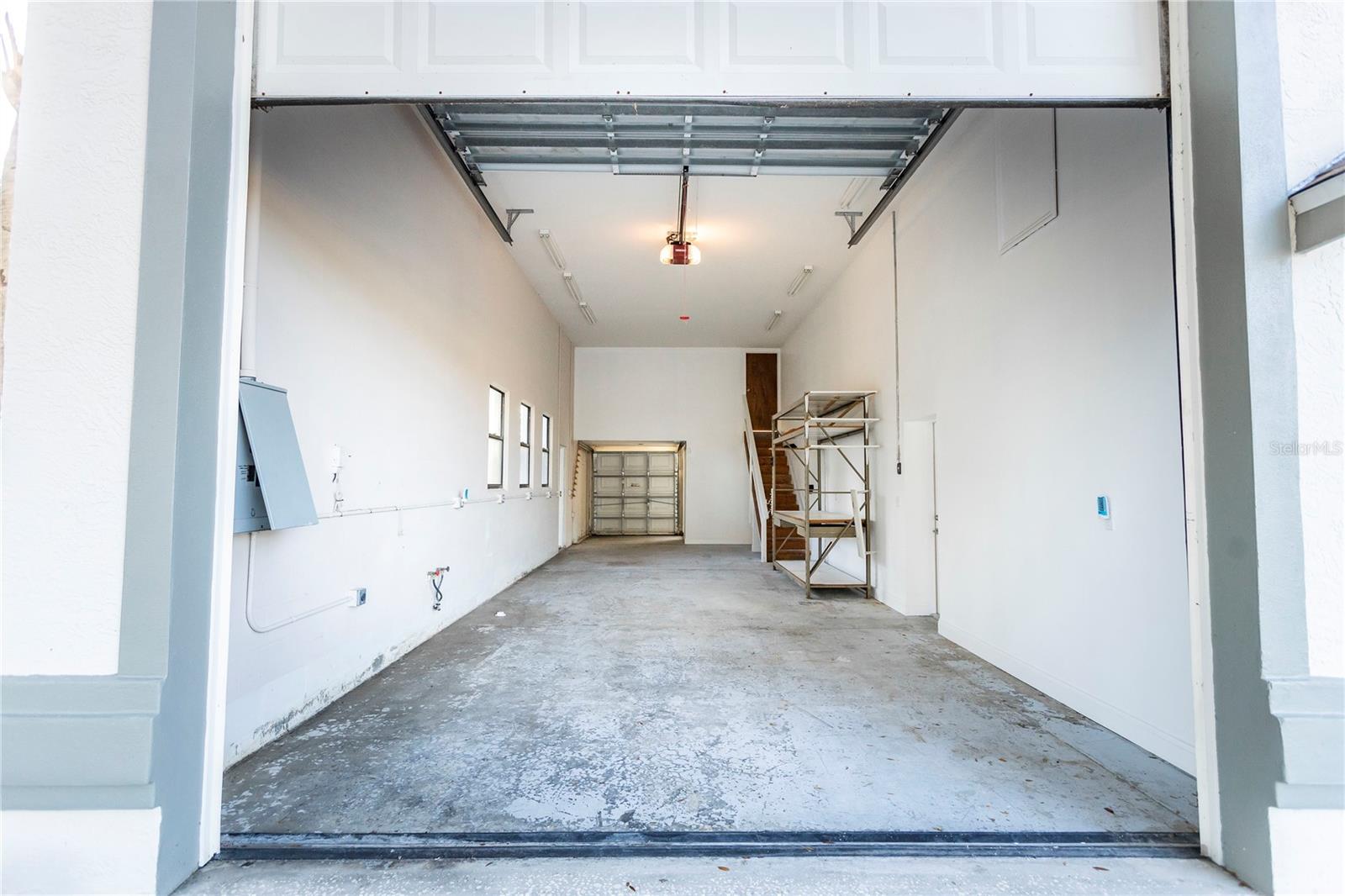 RV Garage entrance from front of house, Golf Cart Garage at rear, Stairs to upstairs Bonus Room