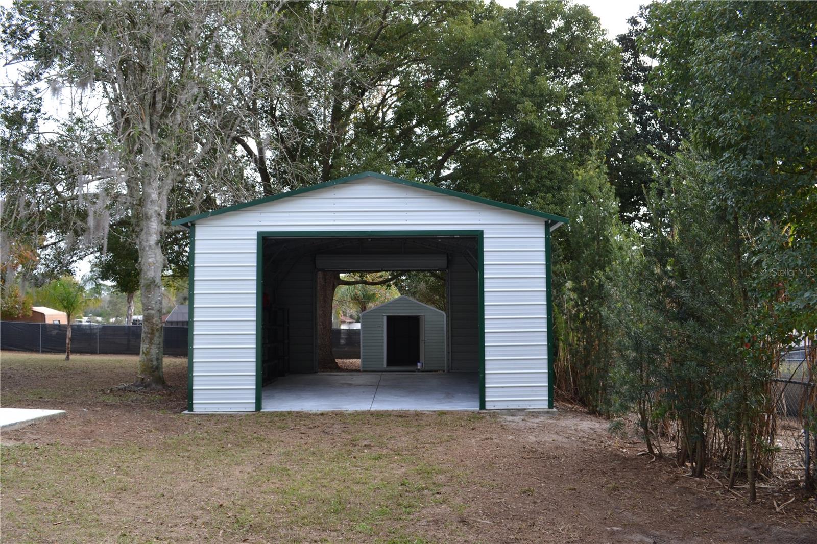 Second garage with storage shed behind