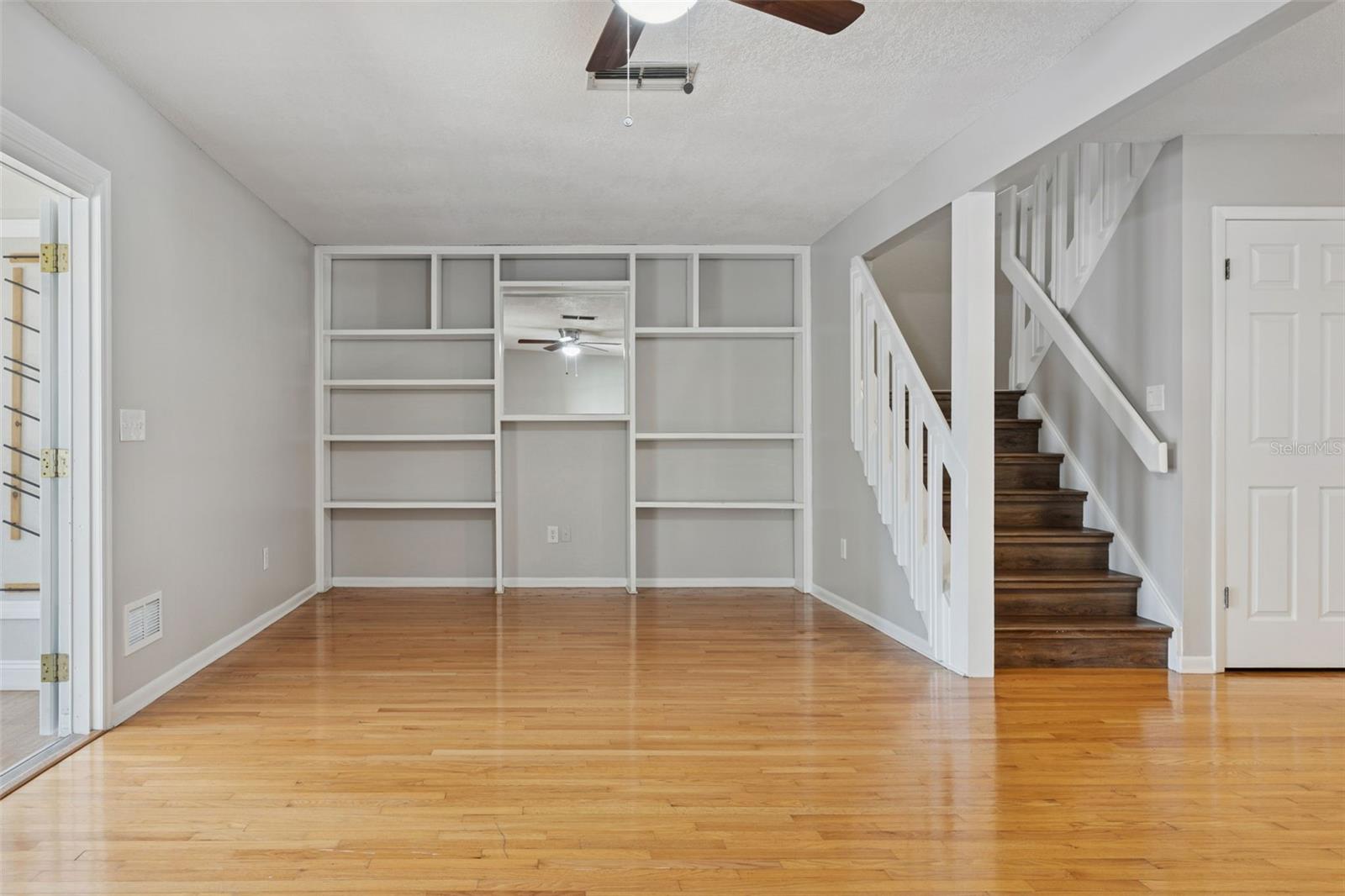 Great room showing enterainment wall/shelving