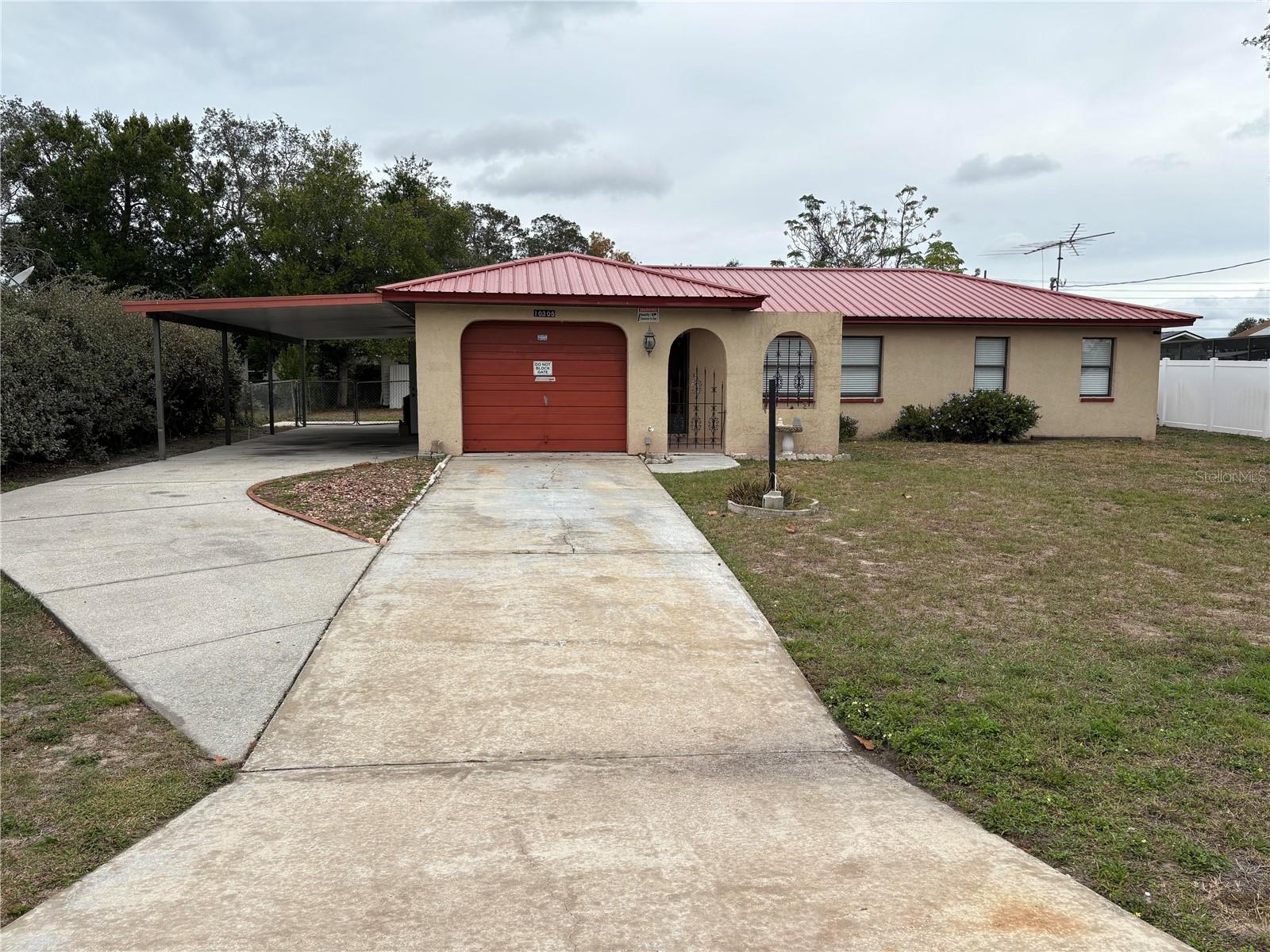 Car Port with Gate to Yard.