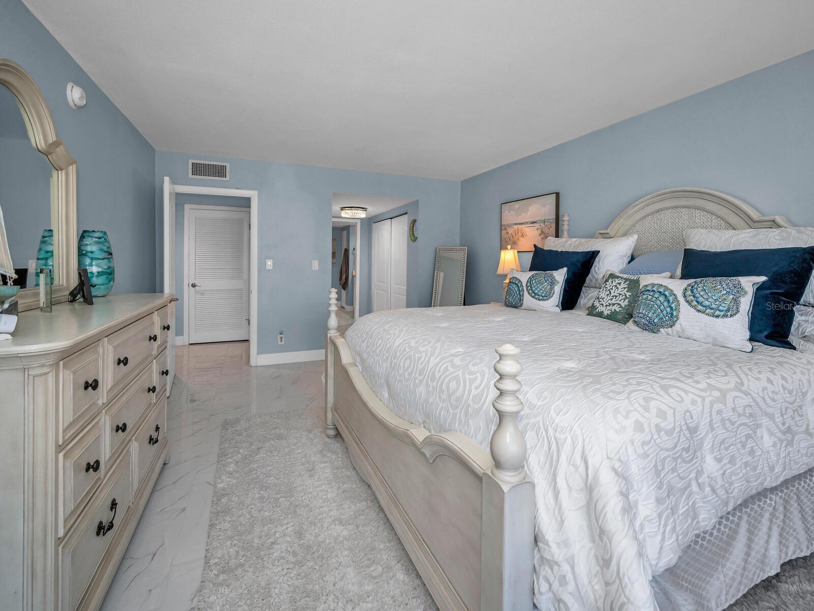 Master Suite boasts upgraded modern baths that boast a relaxed harmony with wood cabinetry, quartz & tiled surfaces, accent fixtures and power flush efficient toilets.