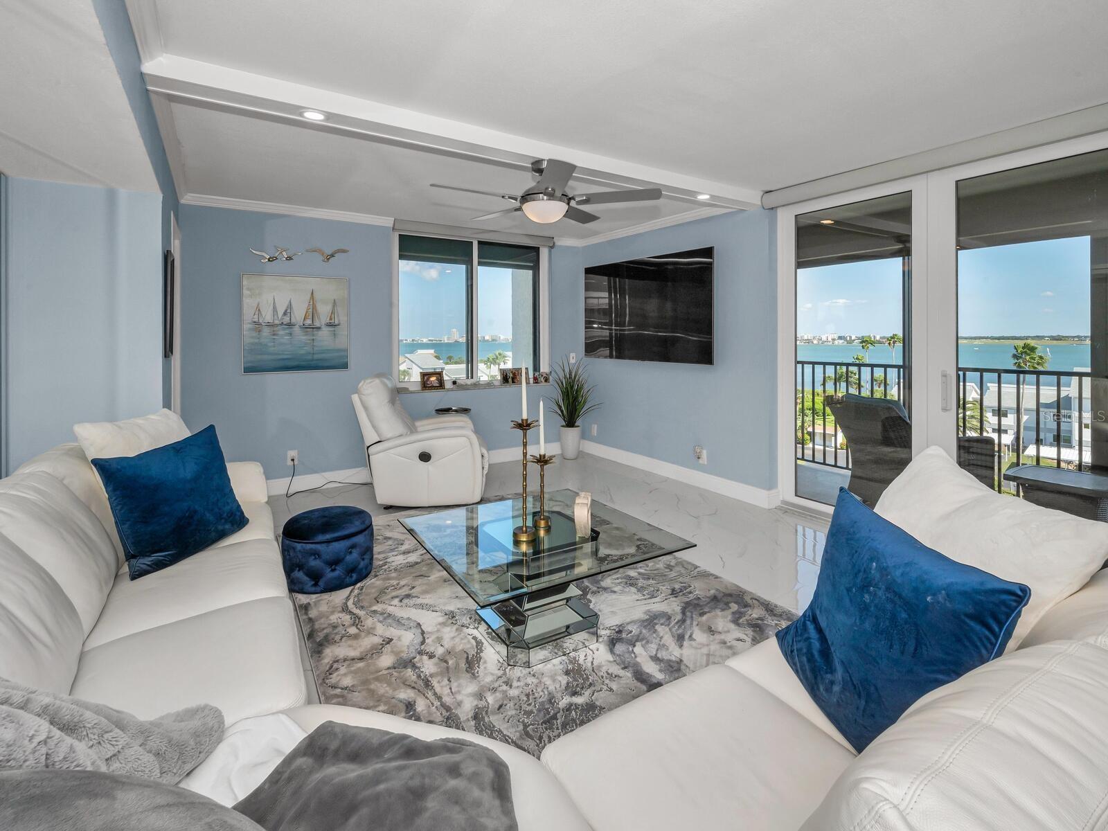 Chic Posh Furnishings (negotiable) Provide for Comfort, Interior Ambiance including an Abundance of Natural Light.  Newer Select Douglas Windows & Sliders to Code  & Hurricane Shutters provide for Added Peace of Mind.