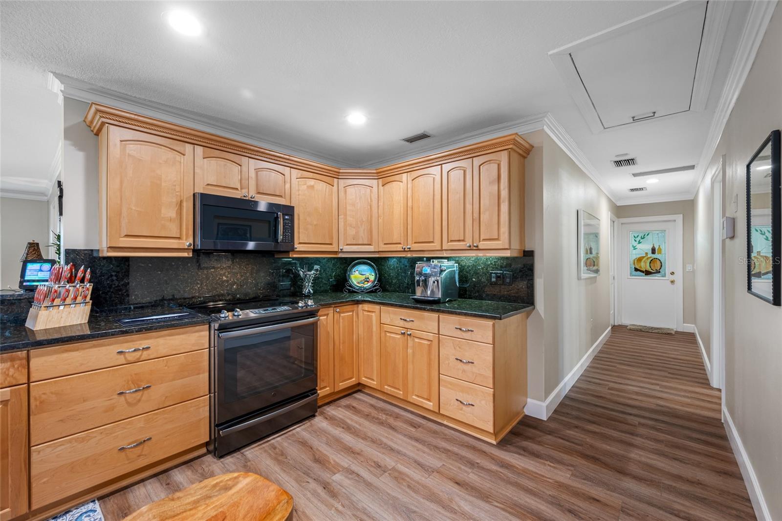 Hallway to Bedroom 4, Half Bath, Interior Laundry and Garage