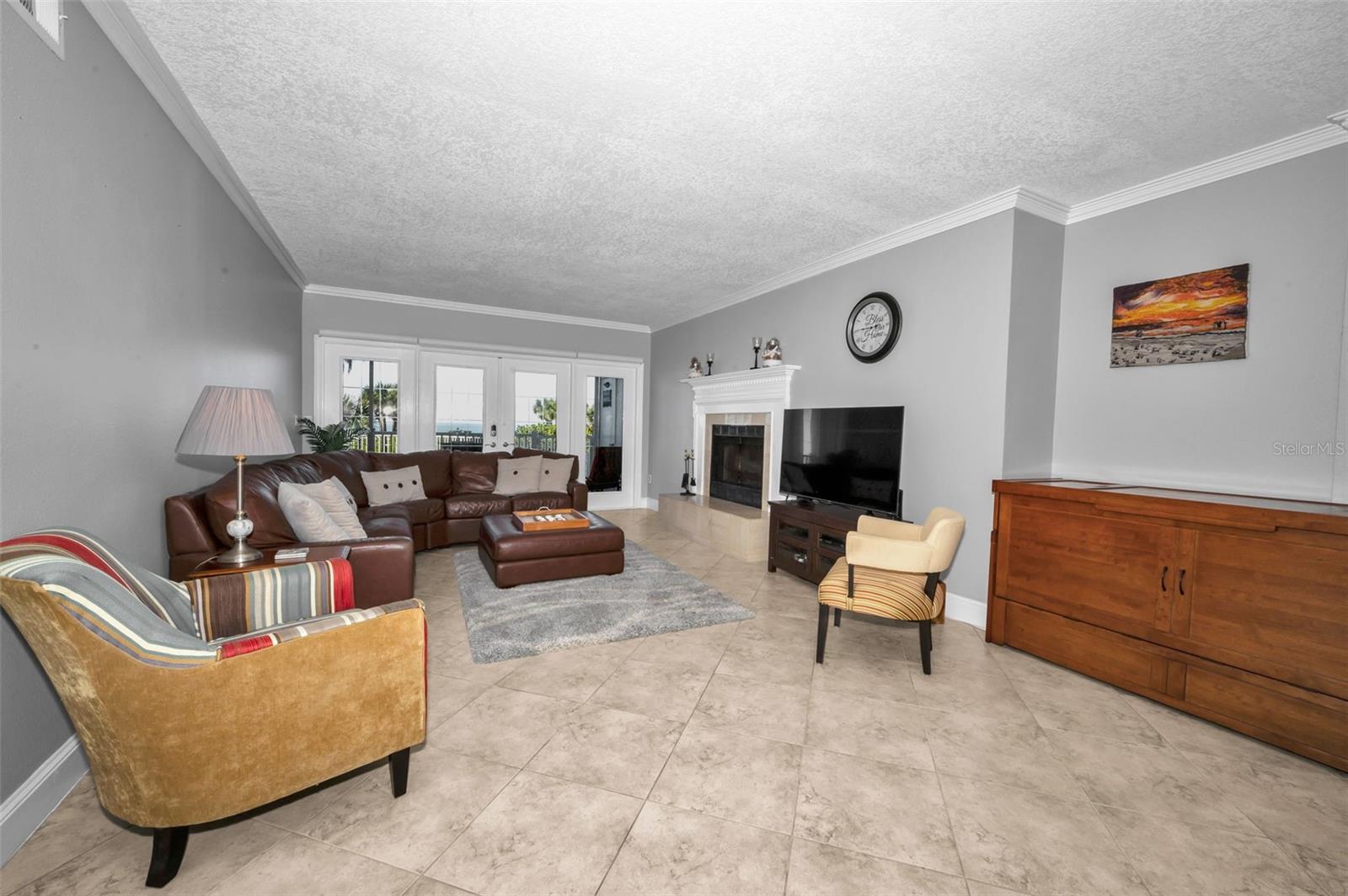 .. 24' X 13.6 Living Room Fronted By Your 18' X 6.5 Gulf Front  Balcony.. Crown Molding - 8.8 Ceiling Heights - Fireplace.. All Good.