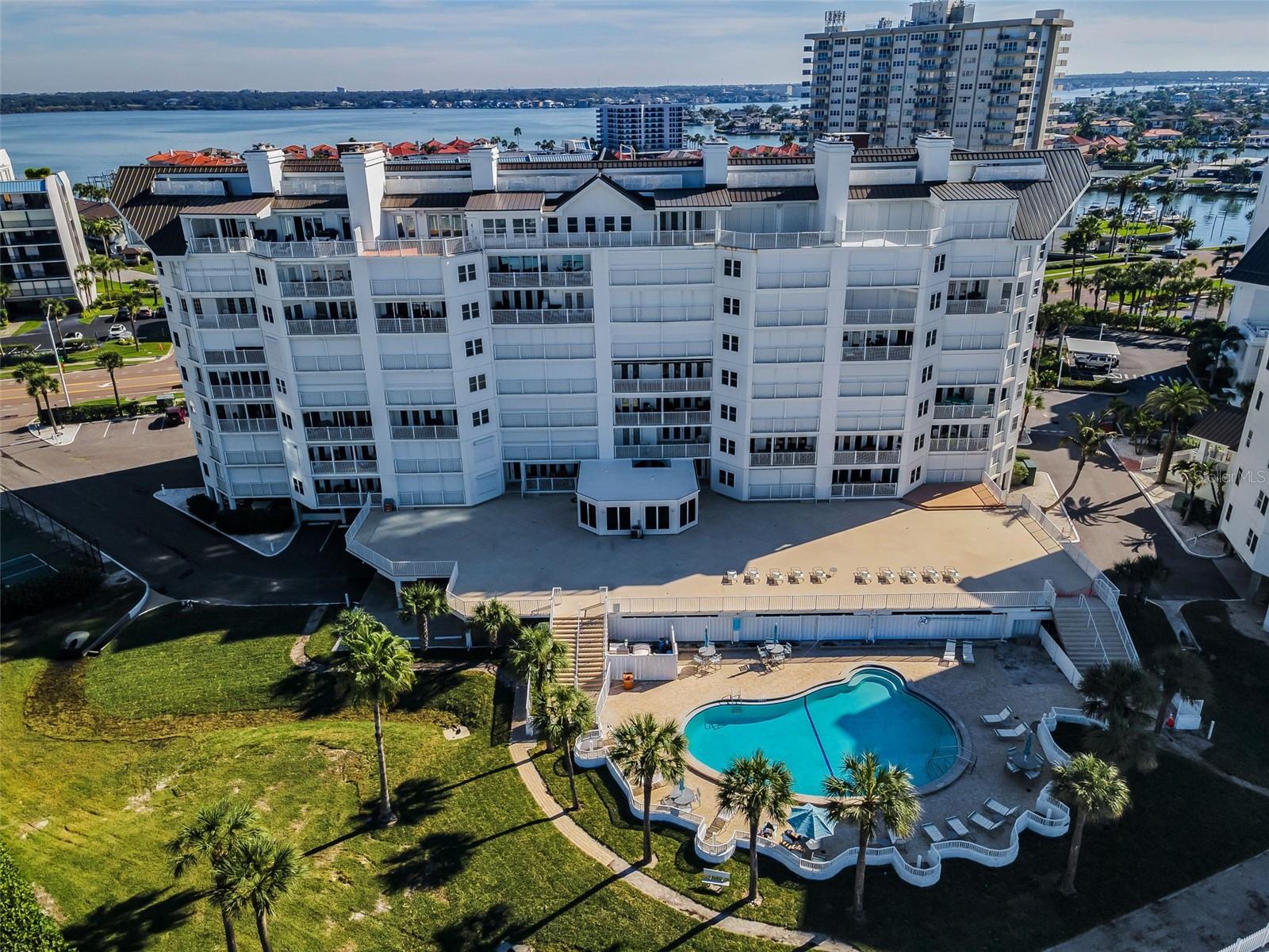 ... Smart Photo Of Gulf Front Exterior Showing Building - Deck Area - Pool Area .. Residence # 1106 Is Located on Left Side 3rd Unit In With Shutters Closed. Good Location on The Quiet Side of Complex Yet Short Walk To Pool Area & Beach.