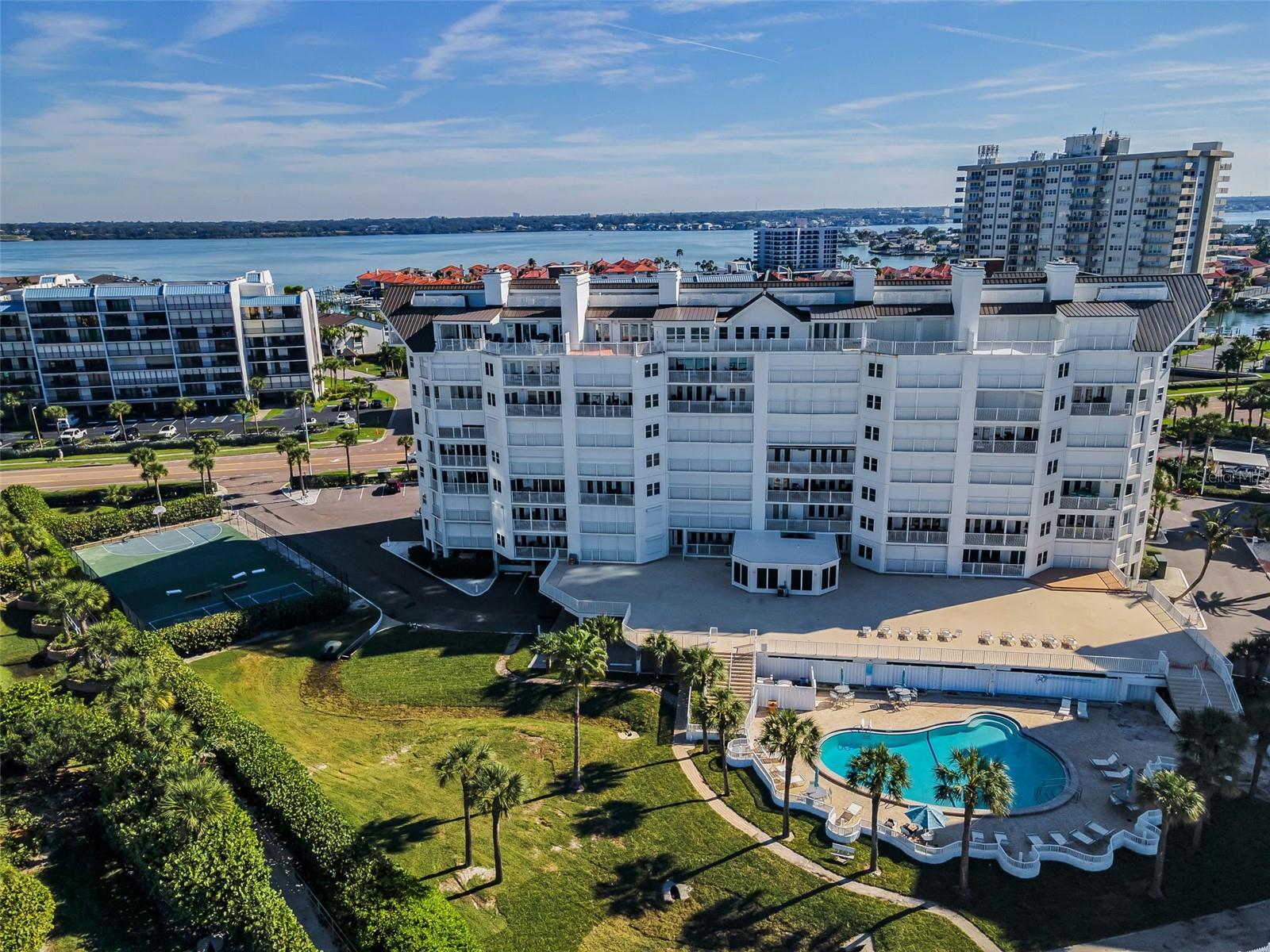 .. Private Tennis / Pickle Ball Courts on Left.. Cabana Club Fitness Facility in Center of Building By Pool - It Has 4 Windows in Photo.