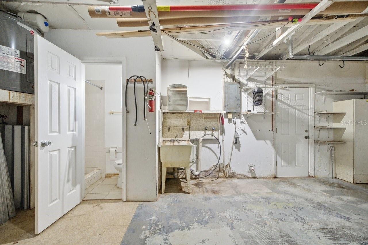 Half bath in garage,  sink and washer/dryer hook up