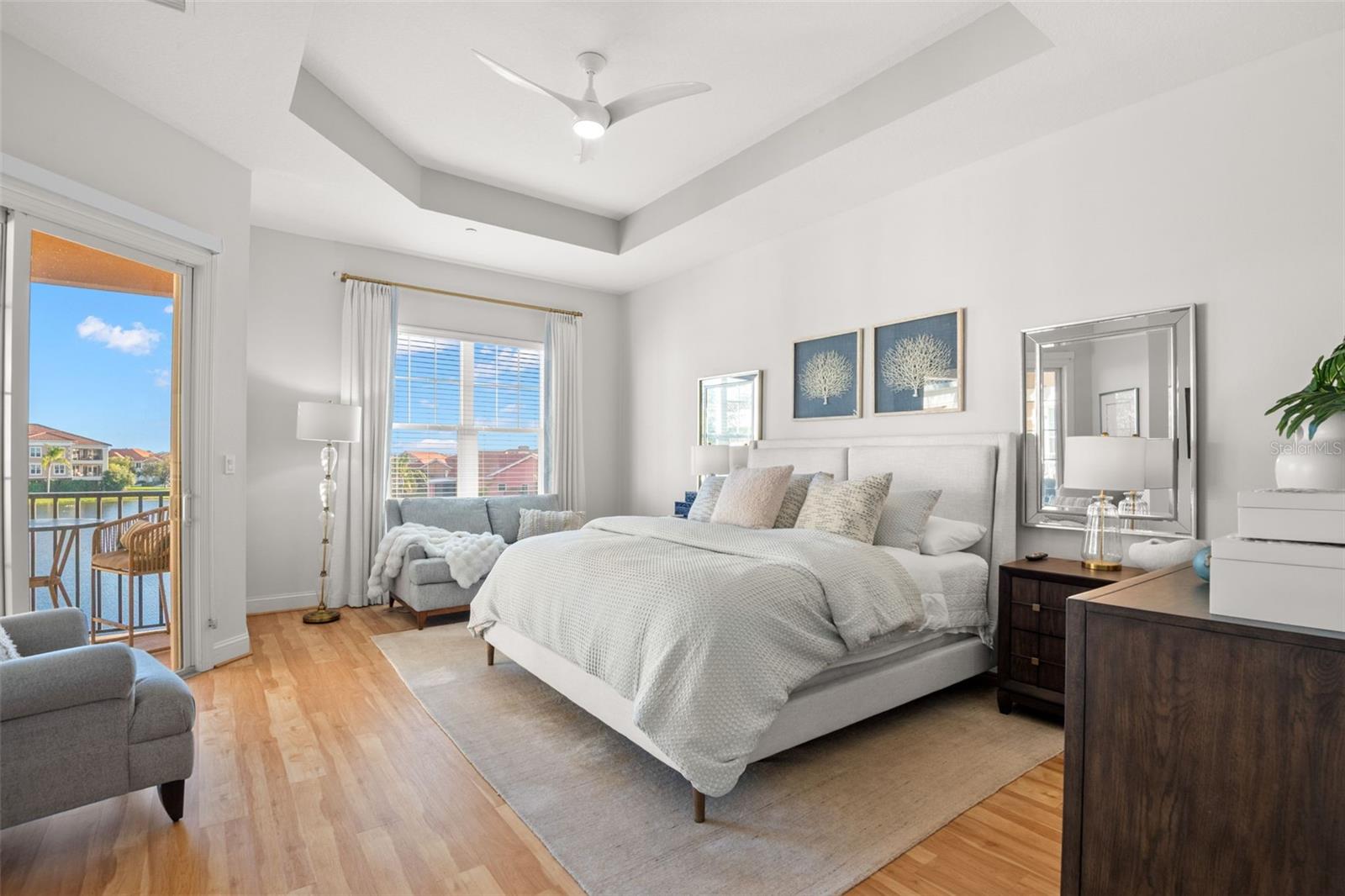 Main Bedroom Suite, featuring a large sitting area, king-size bed and access to the covered terrace.