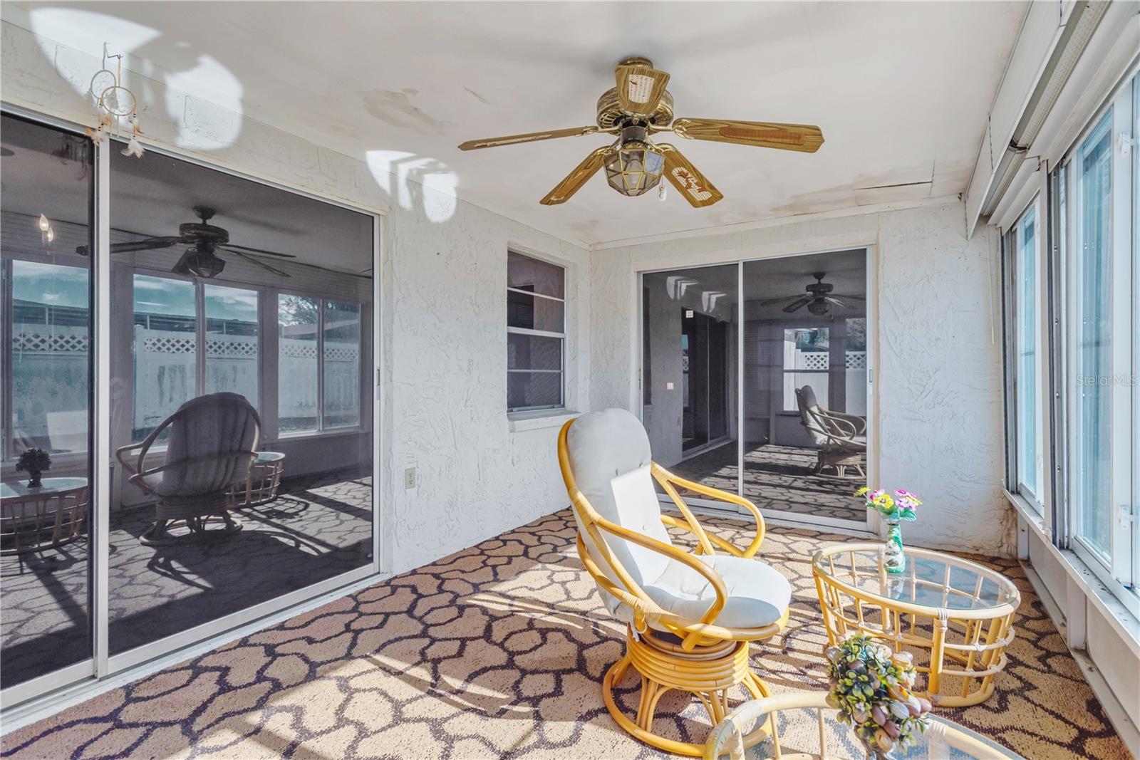 Another view of back porch with Dining room sliders to the left and Family room sliders