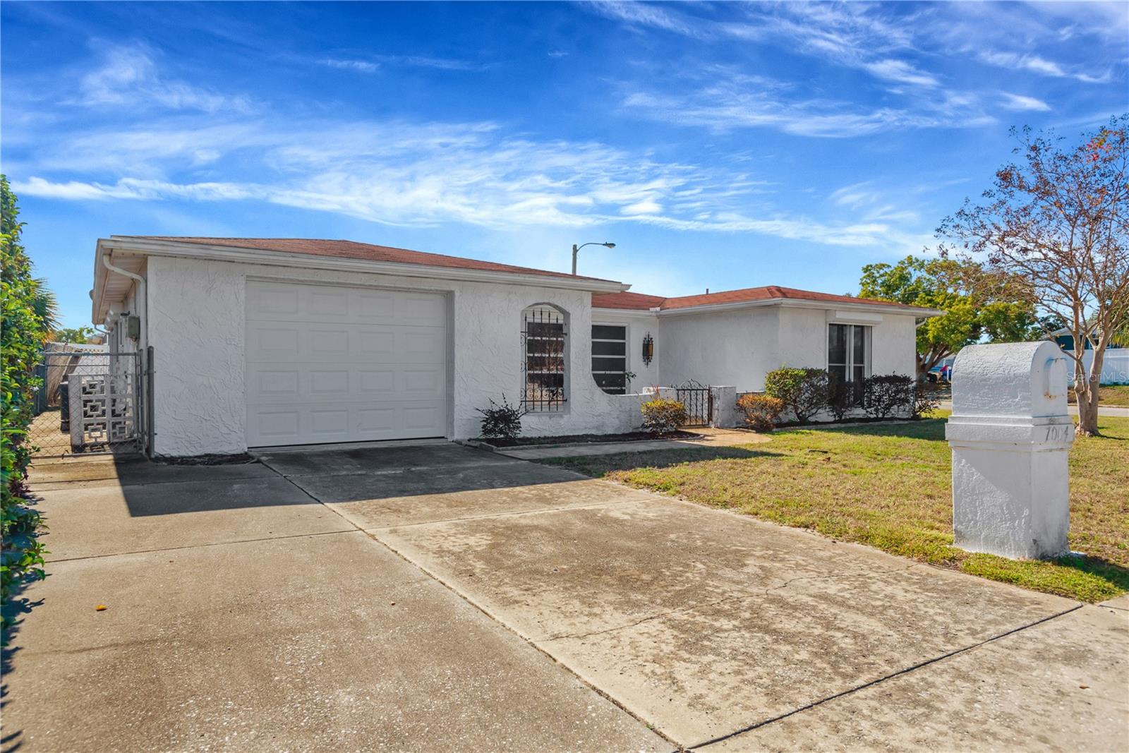 Oversized driveway leading to the garage