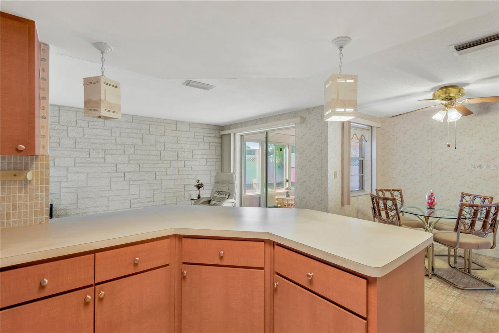 View from kitchen into Family room and back porch
