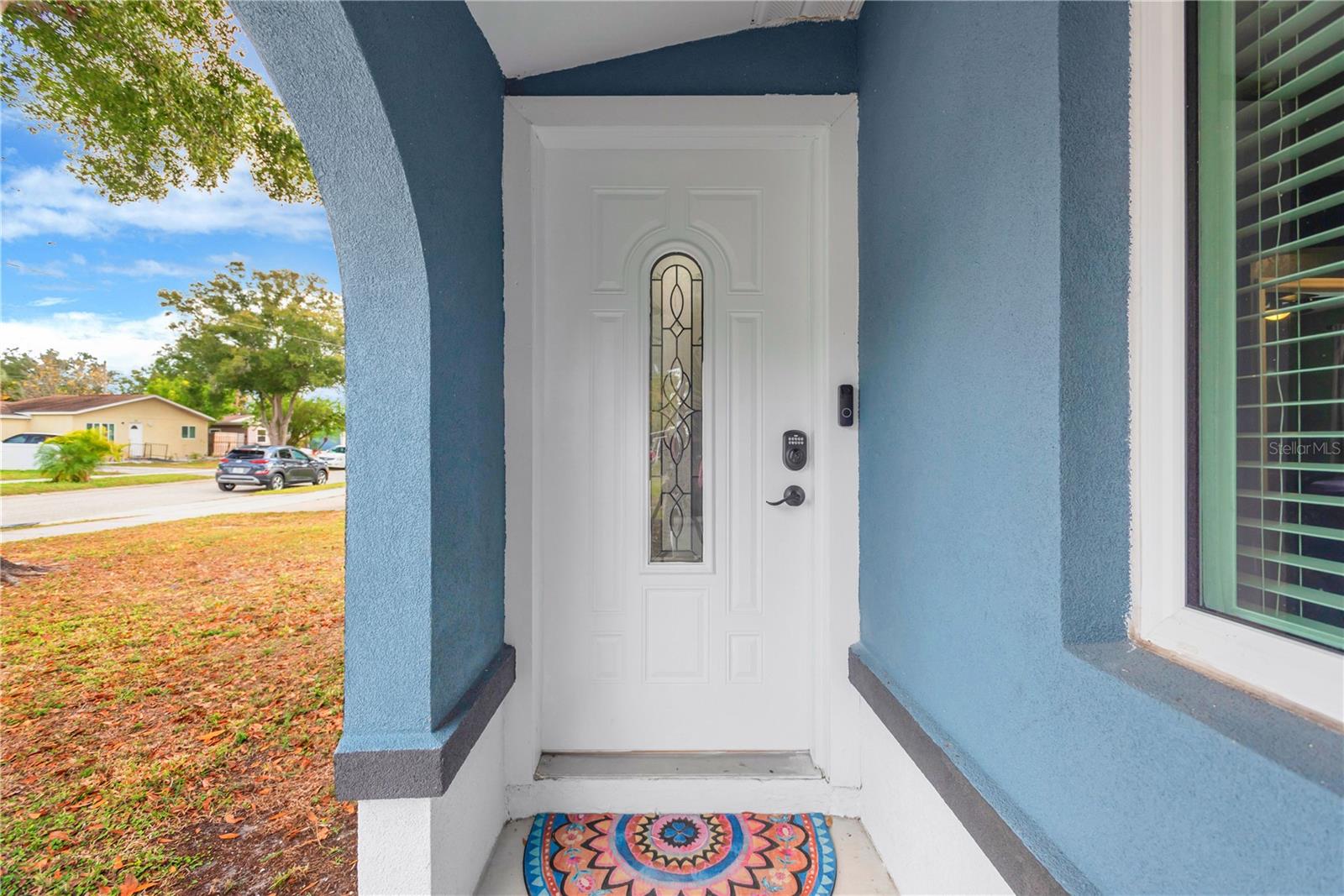 Front door tucked behind an arch