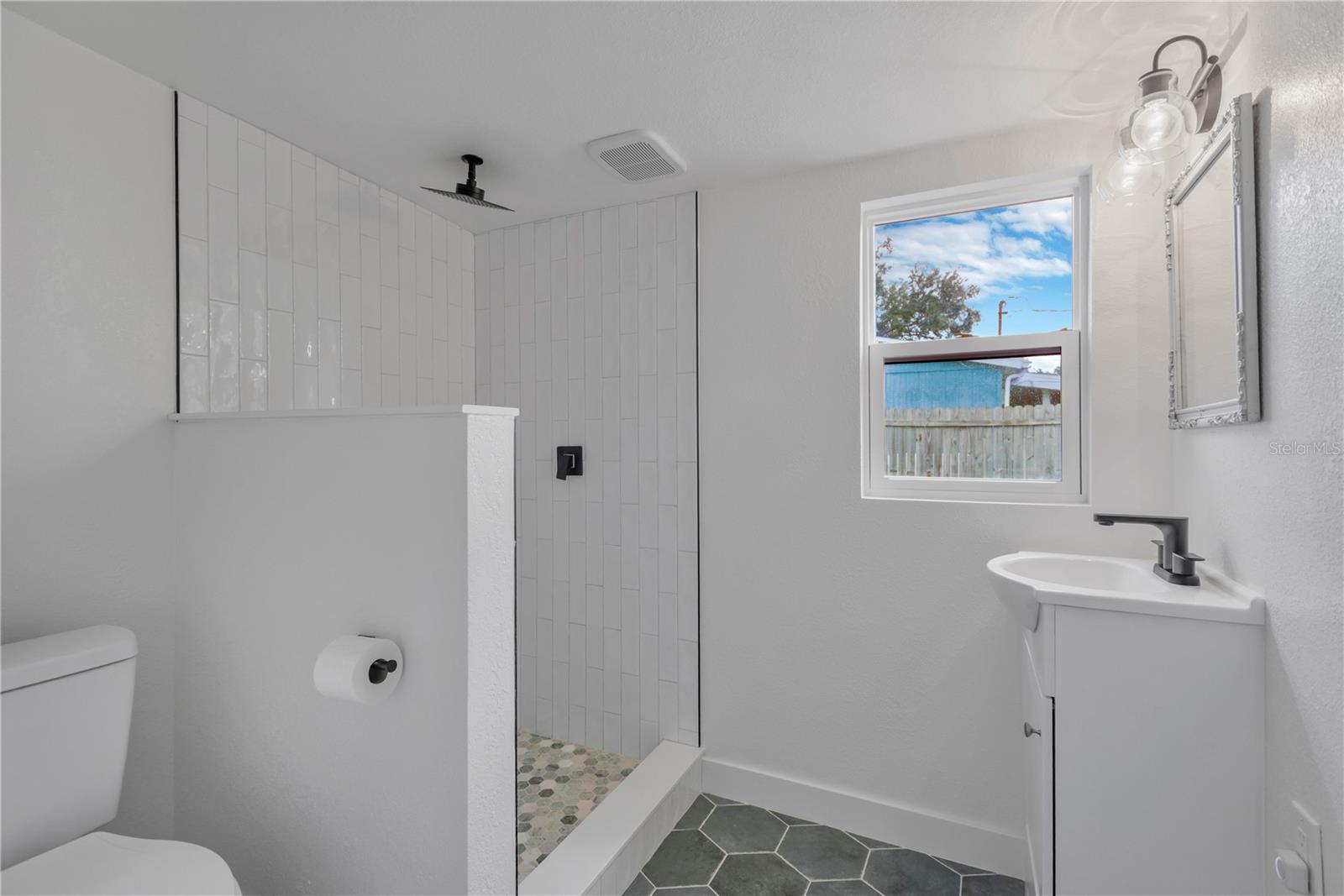 Guest bath number 2 located off of the Den area