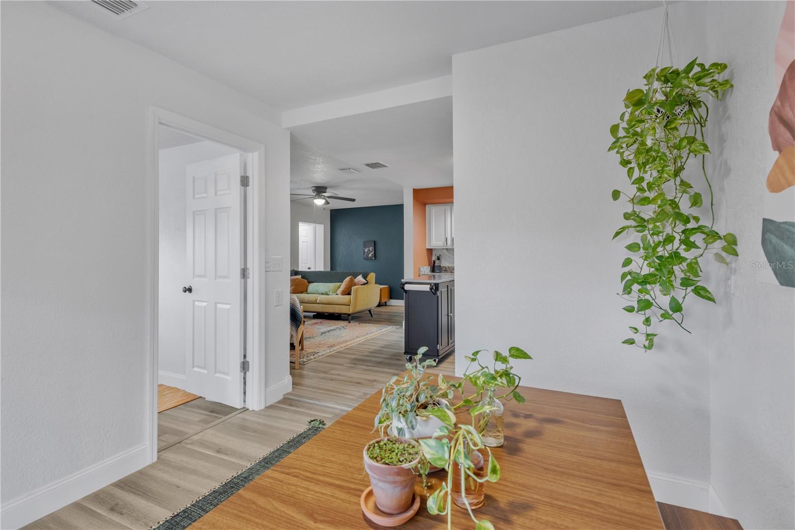View from Dining room looking back towards the Living room. Door on the left leads to bedroom number 3