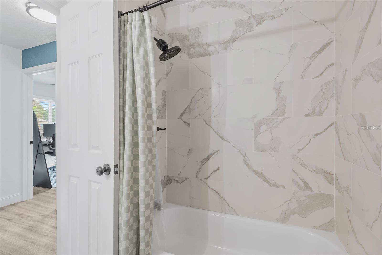 Guest bath off of Primary bedroom with tub/shower combo