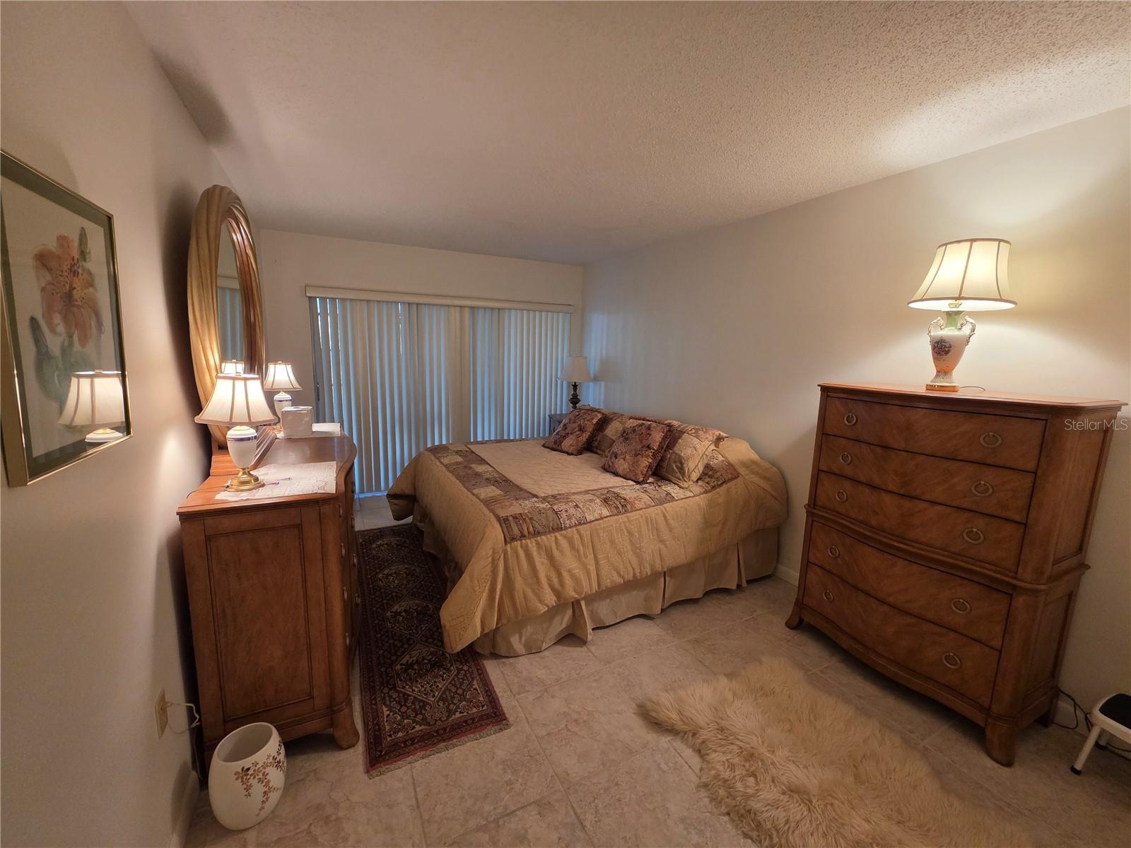 Spacious Bedroom also with sliding glass doors opening to your private enclosed porch.