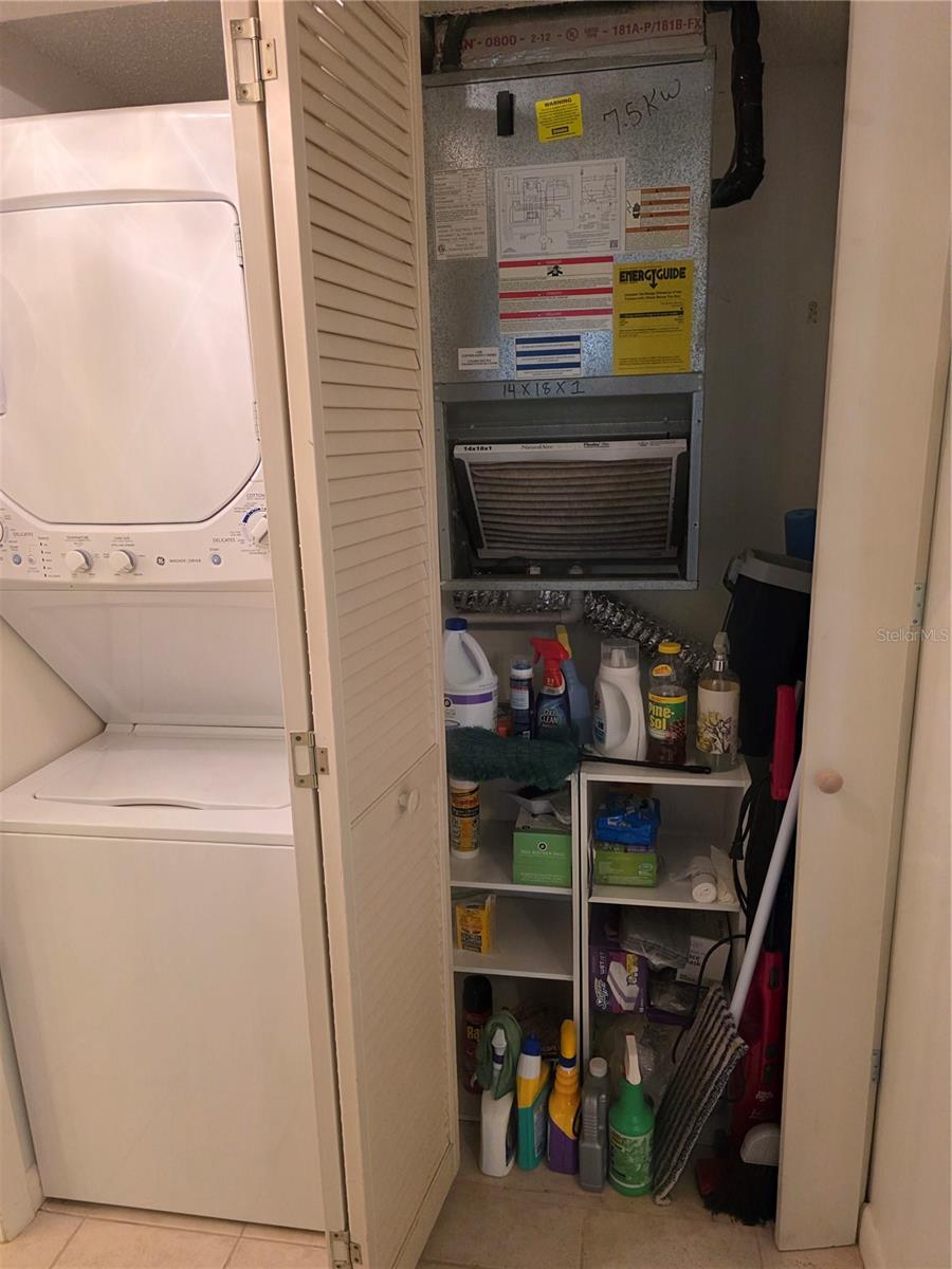 Large storage closet with central air and heat unit.