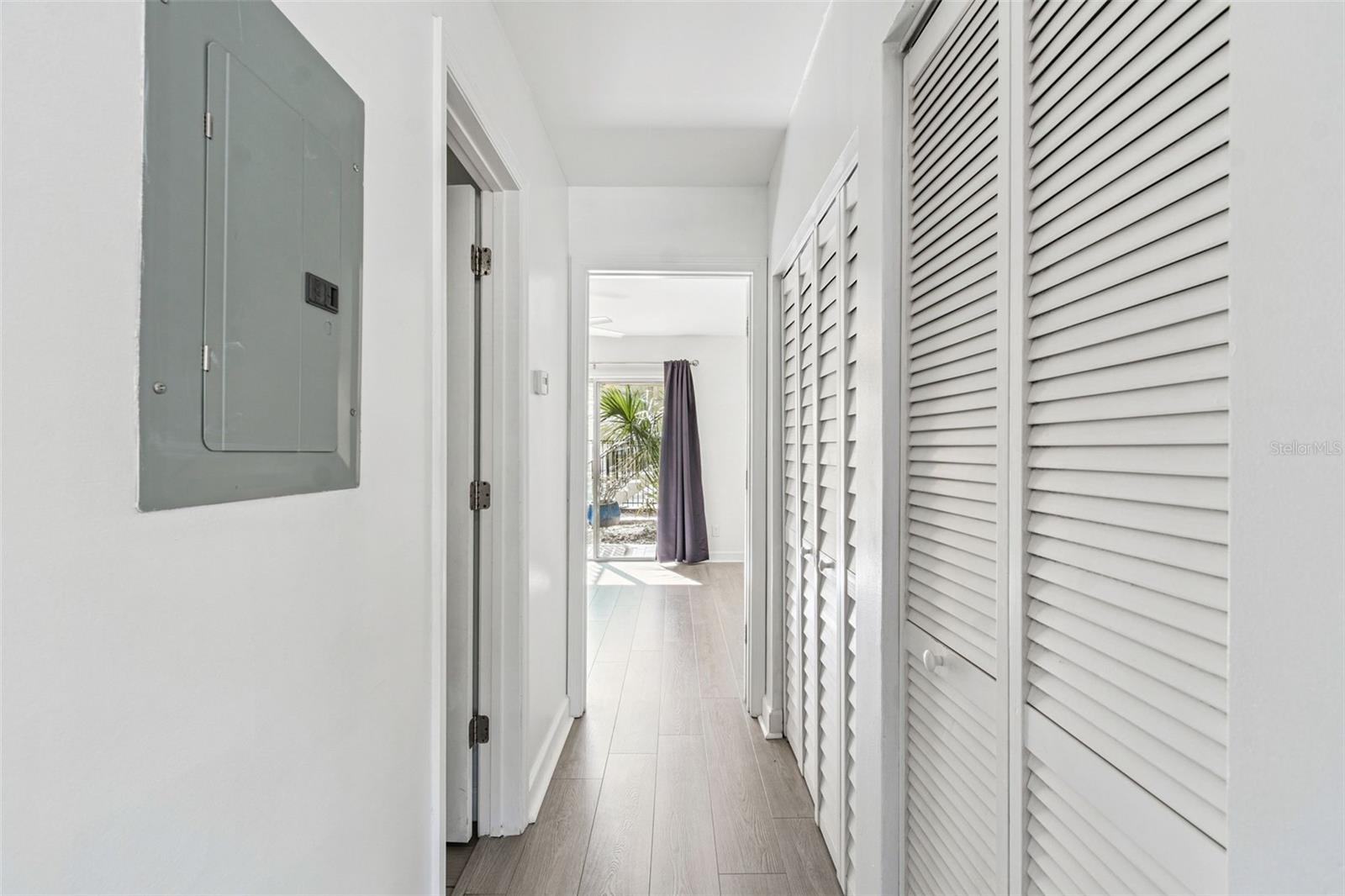 From the kitchen to the Primary Bedroom/ Patio doors to the pool!