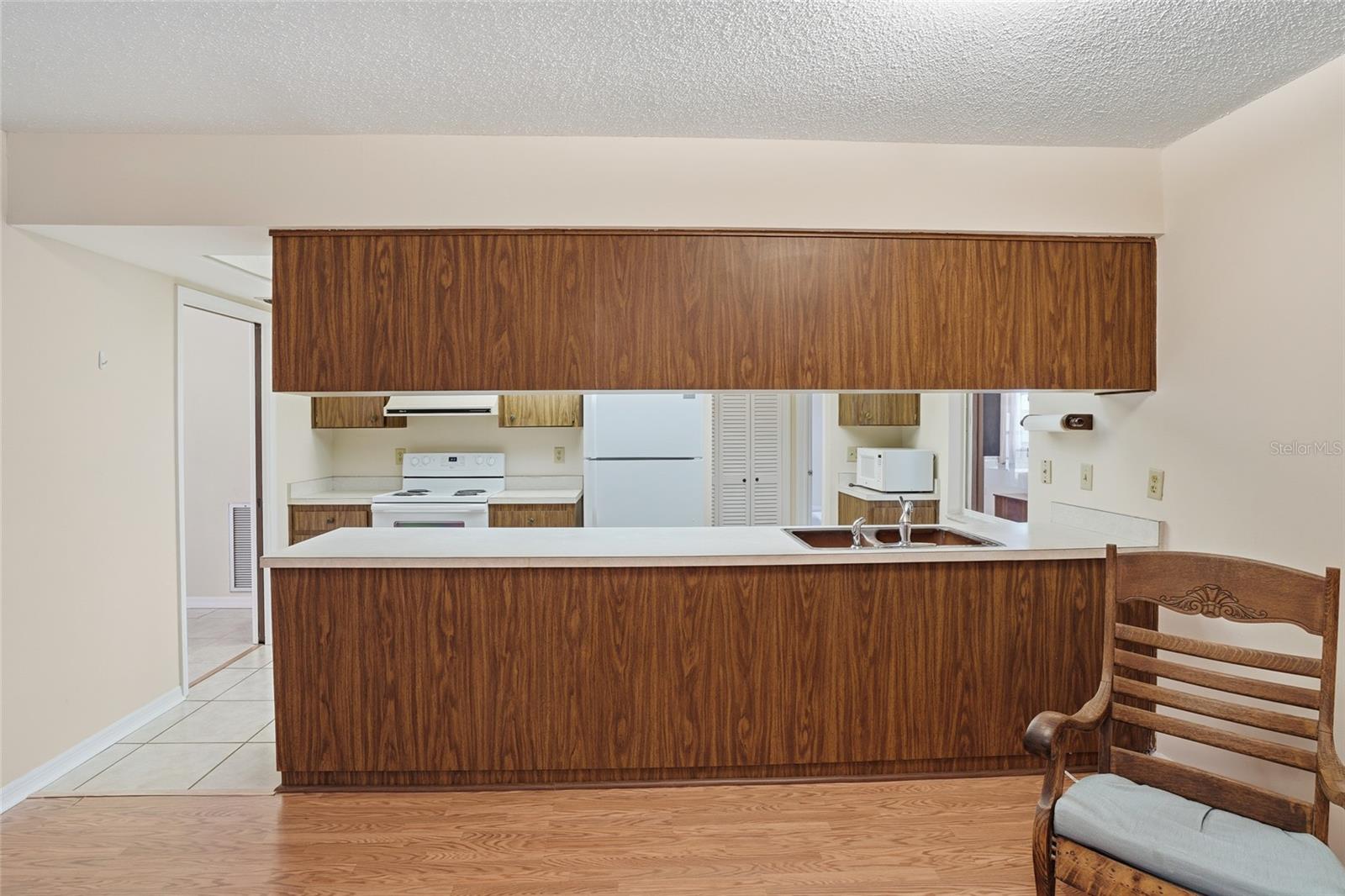 Spacious galley type kitchen with pantry