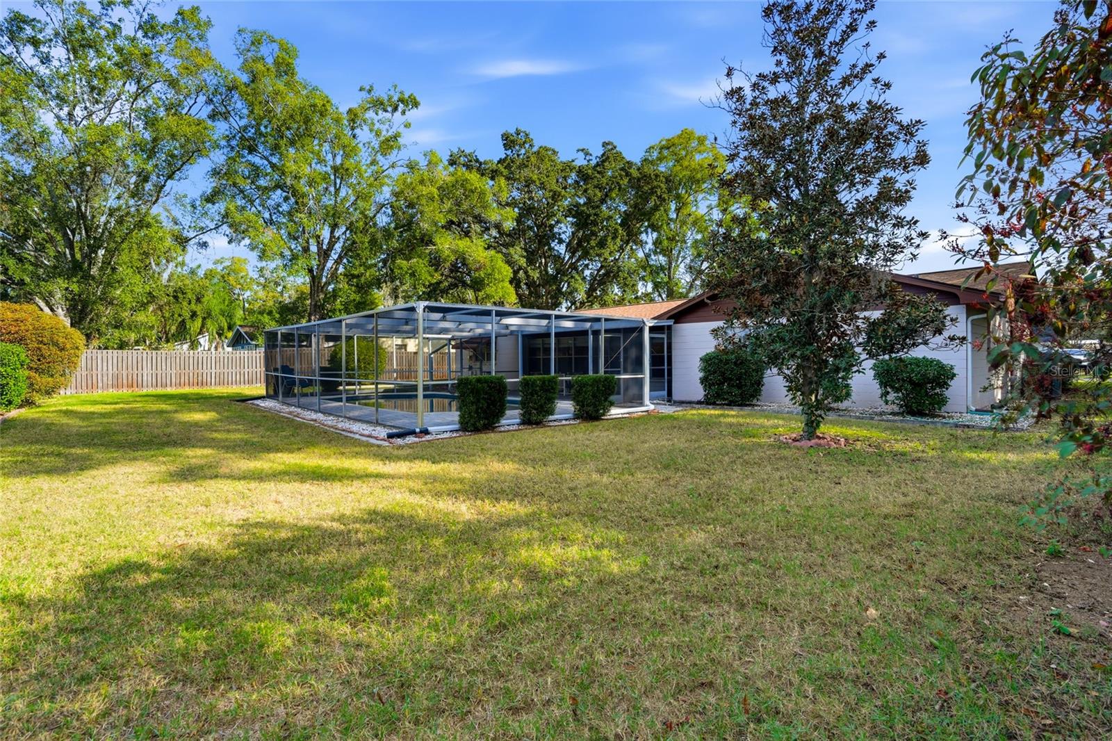 Very large, fenced level backyard